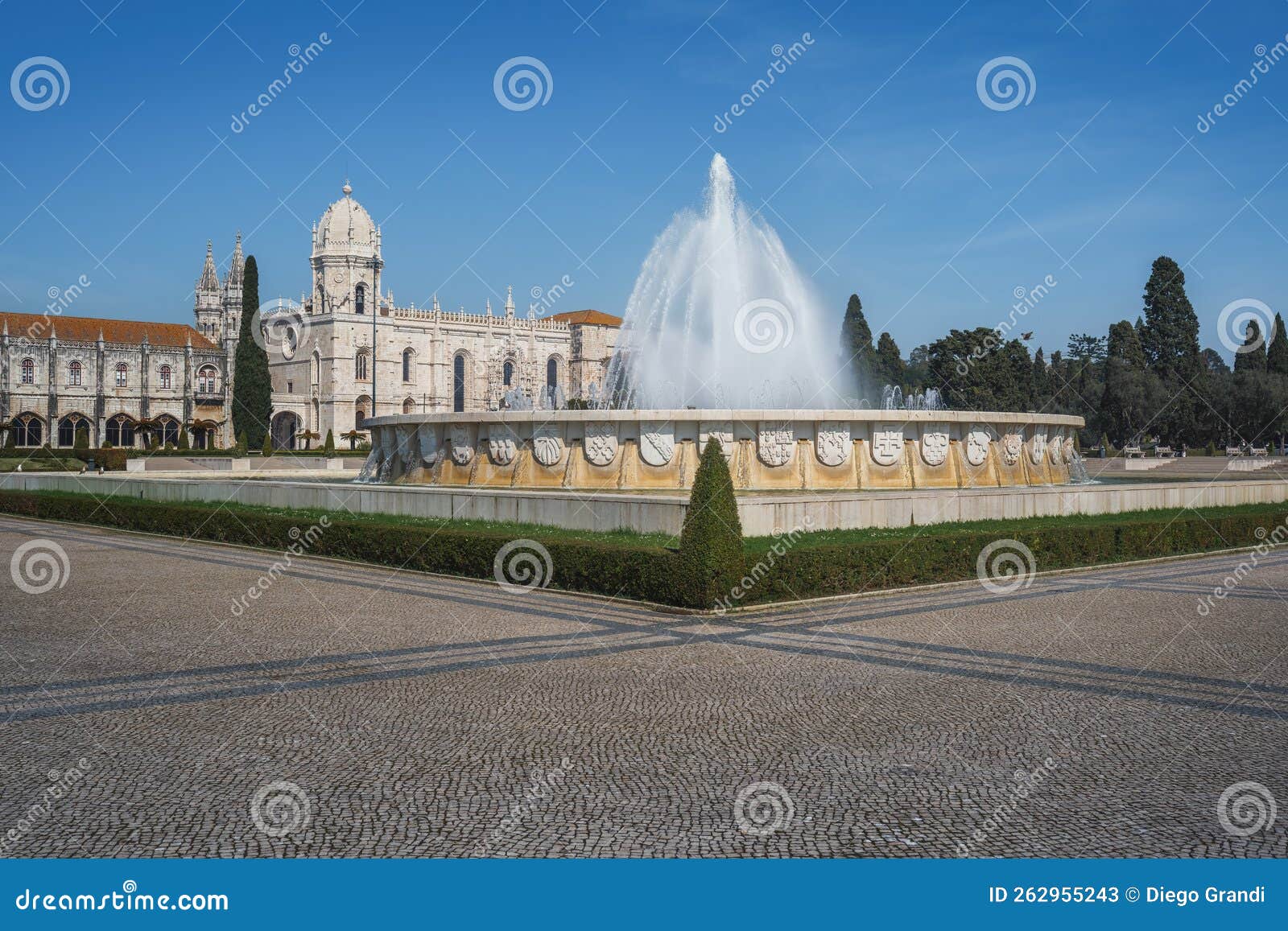 fountain at jardim da praca do imperio square with jeronimos monastery - lisbon, portugal