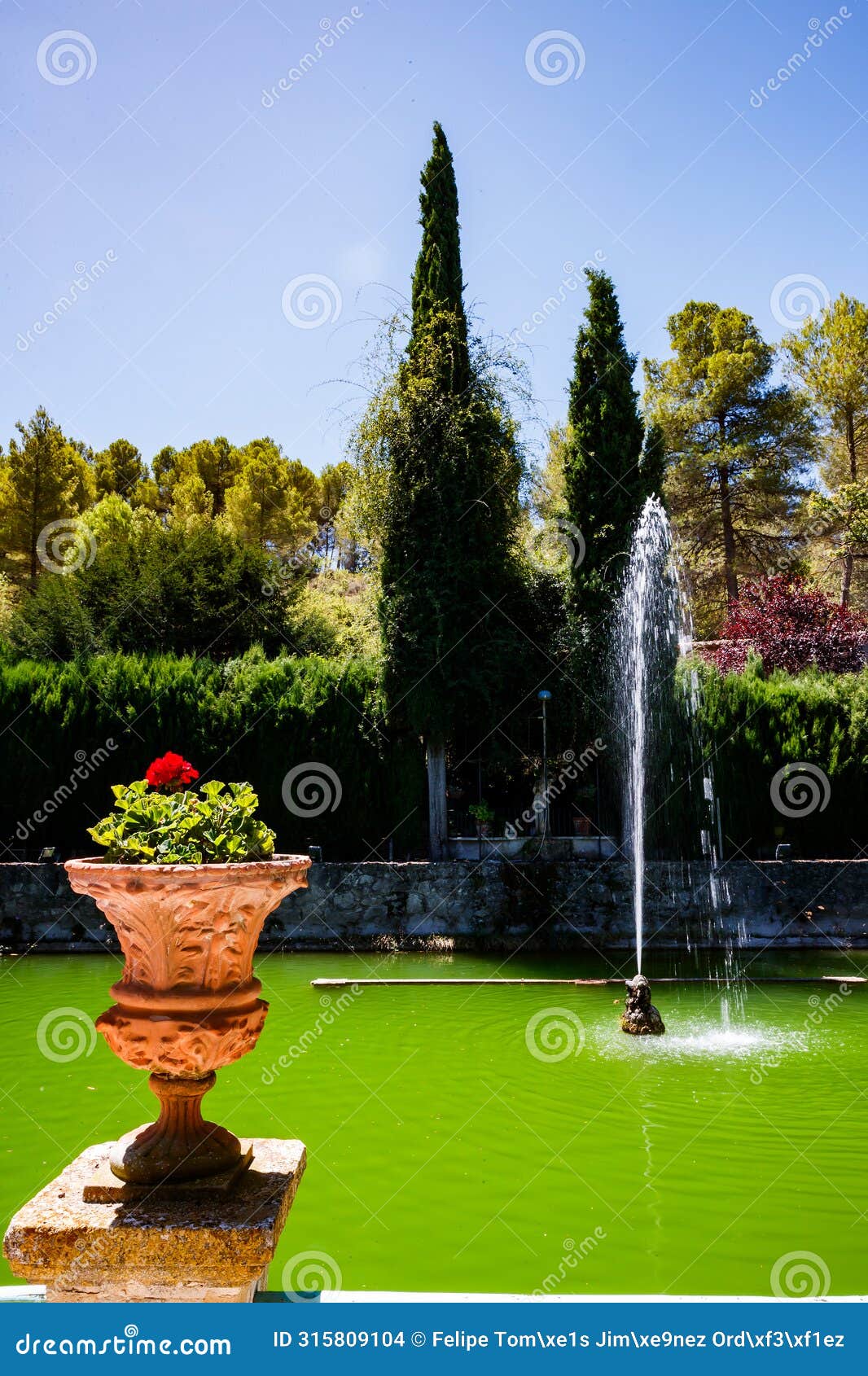 fountain and planter in the garden of santos in penaguila