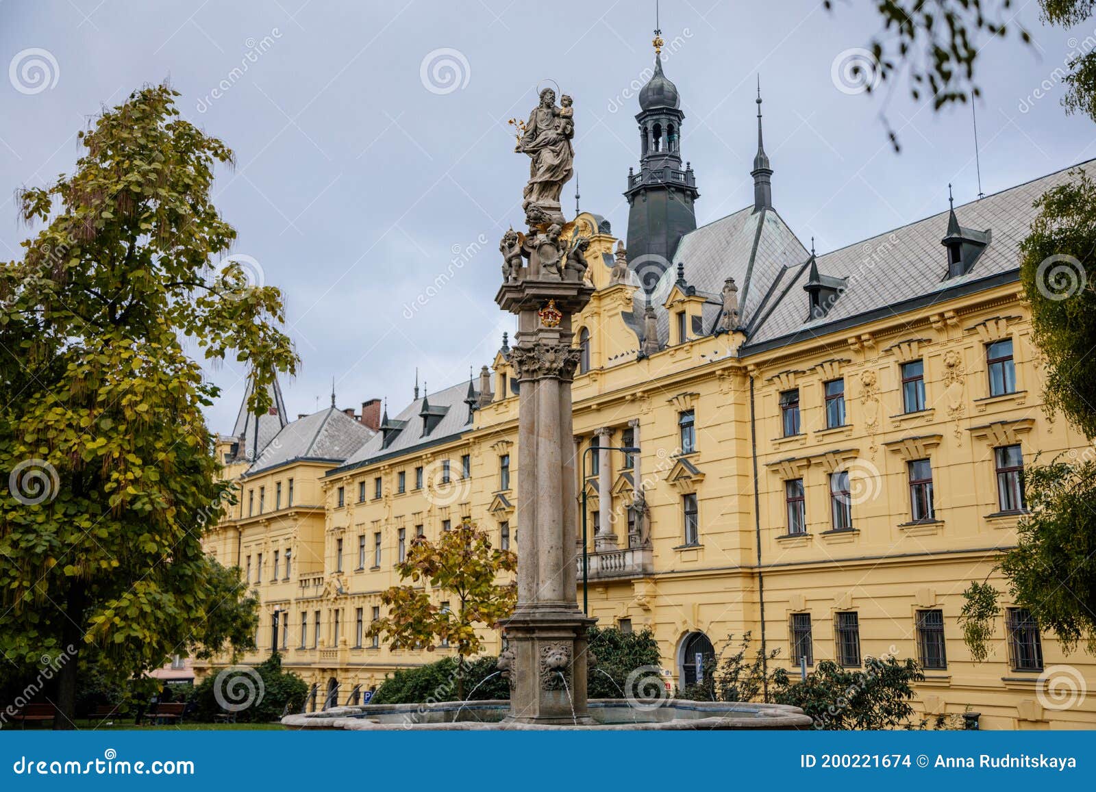 fountain with a statue of st. josefa at charles square near the renaissance building of municipal court and new town hall in the