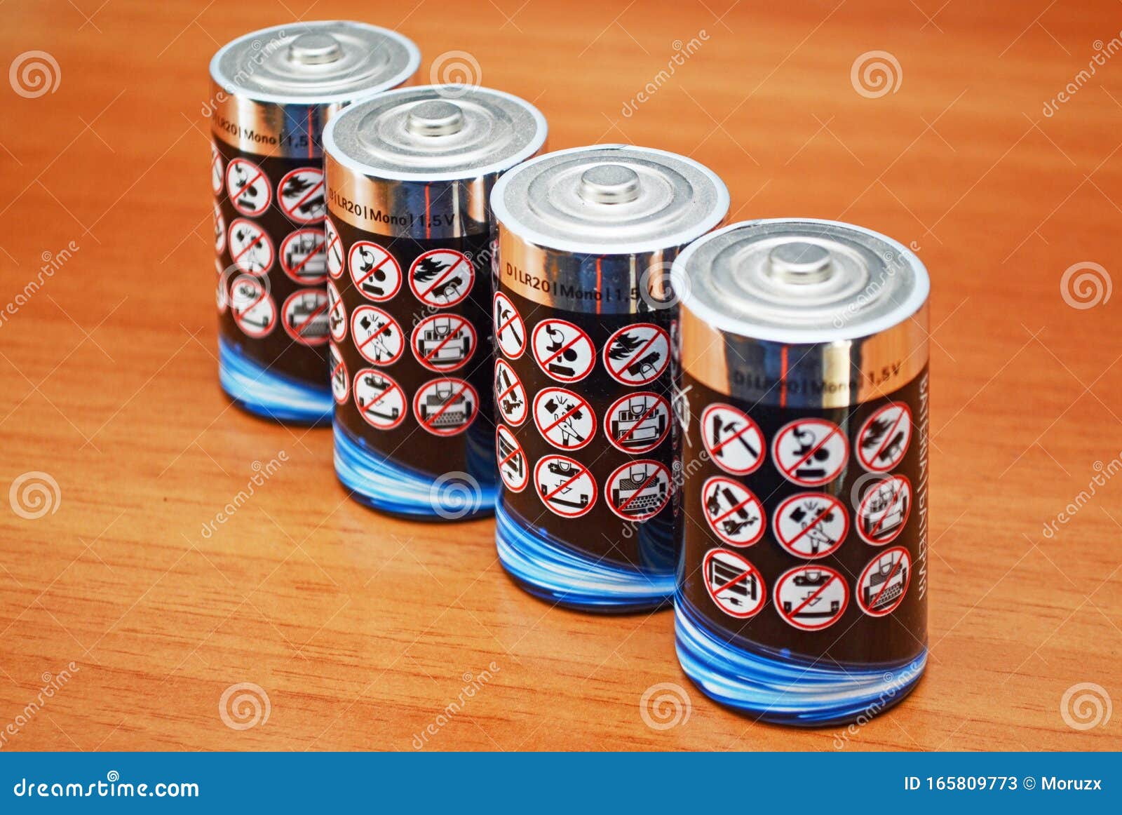 alkaline battery cells with warning message icons on them