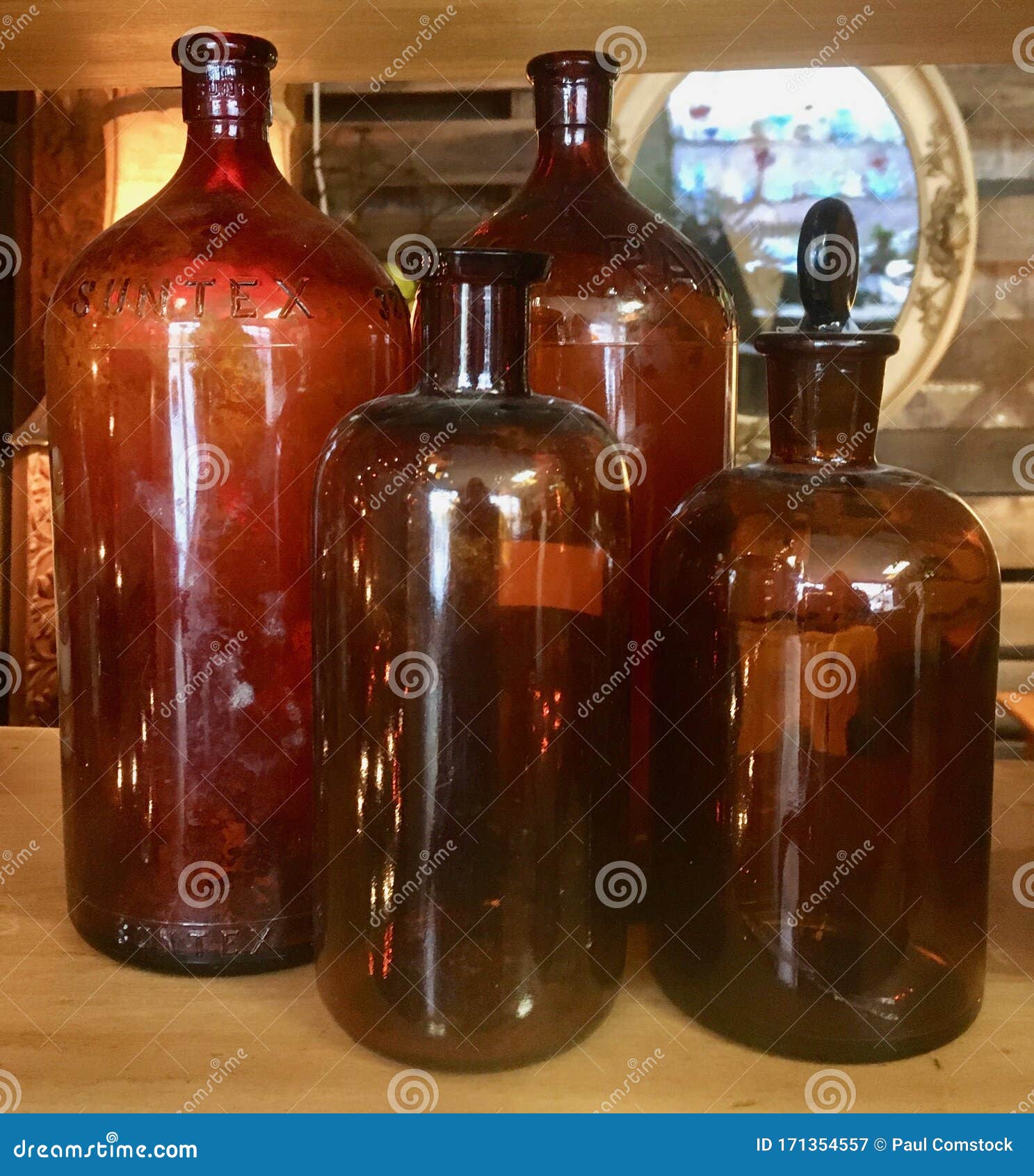 Four antique brown bottles stock image. Image of retro 171354557