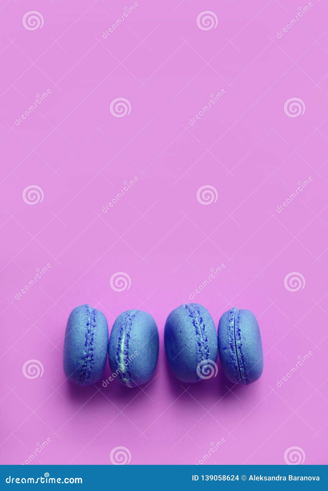 Four Blue Macaroons on the Side on a Pink Background Stock Photo ...