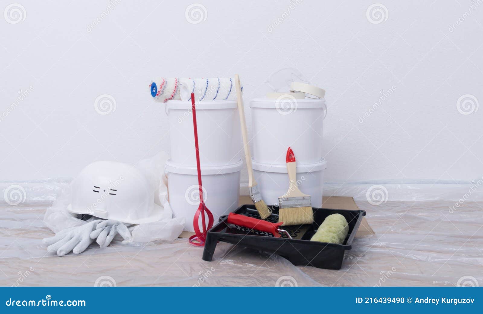 Four Buckets, Bath and Paint Rollers, Red Mixer, Repair Kit Stock Photo