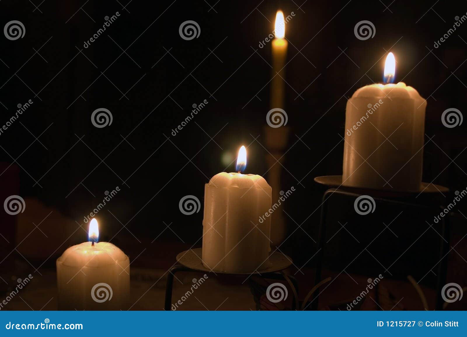 Four candles stock image. Image of light, colour, dark - 1215727