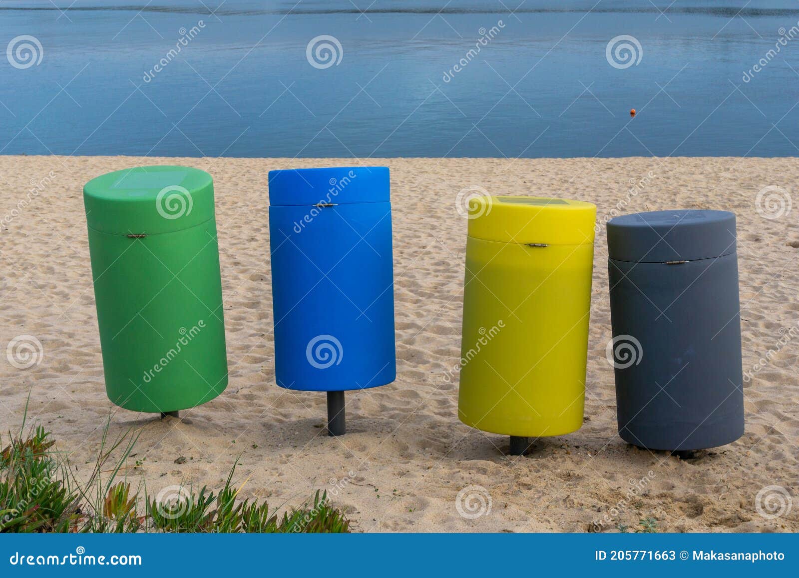Colorful Recycling Bins on a Sandy Beach Stock Image Image of four