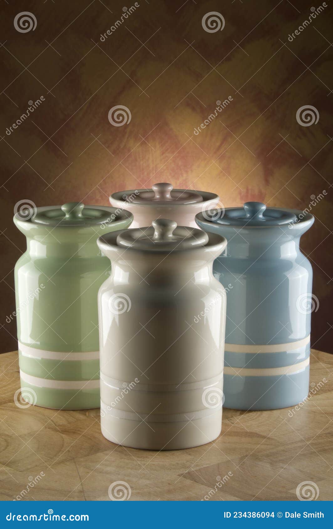 Ceramic Canisters, One Lying On Its Side On Wood Bench With Rice