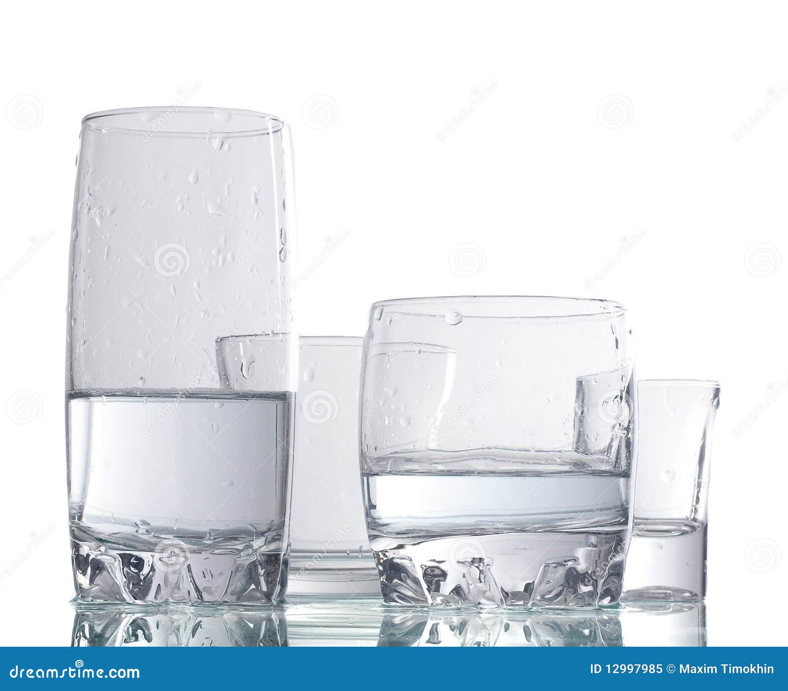 Four cups of liquid stock image. Image of simplicity 12997985