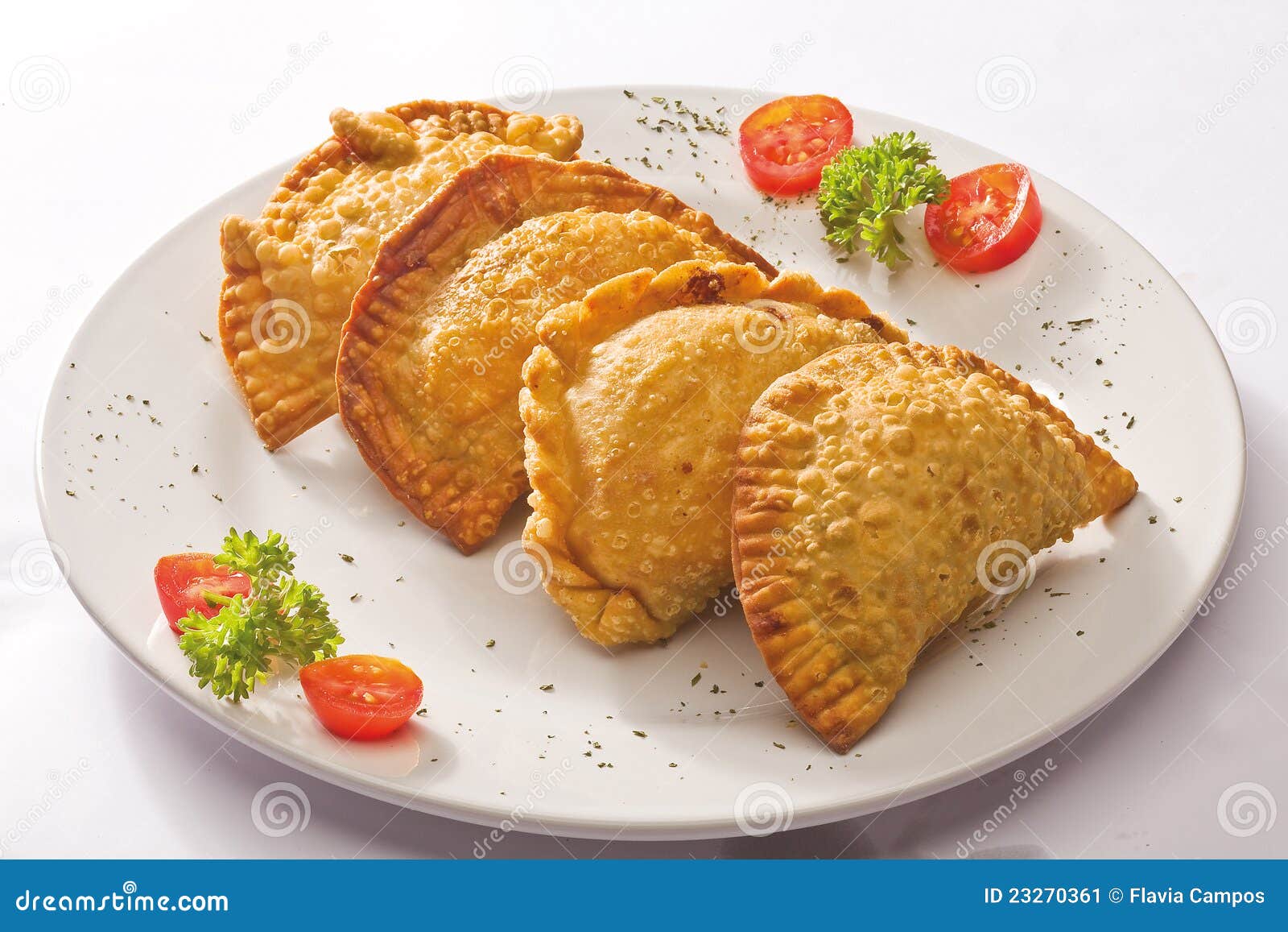 four empanada on plate