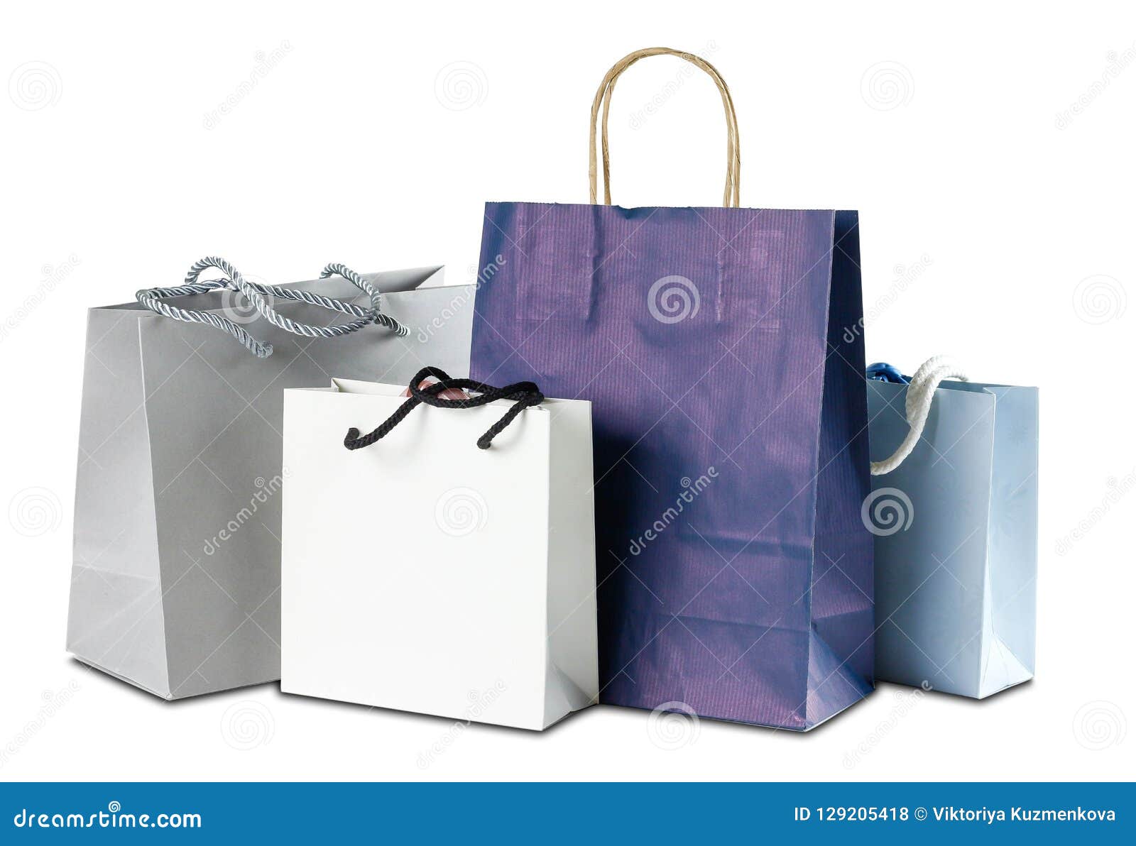 Four Gift Colored Paper Bags On White Background. Close Up Stock Photo ...