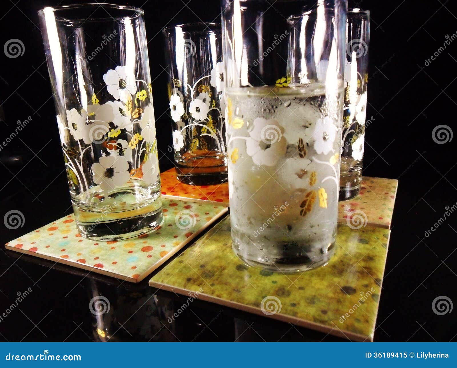 Four Glasses on Drink Coasters Stock Image - Image of iced, drink: 36189415