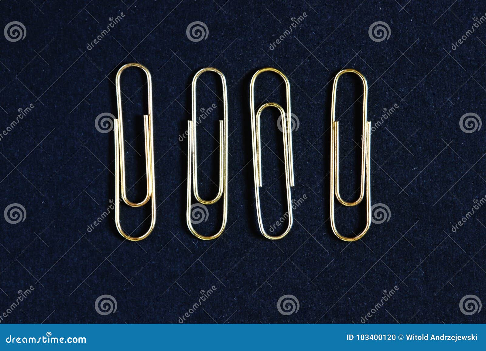 Four gold paper clips stock photo. Image of clips, tool 103400120
