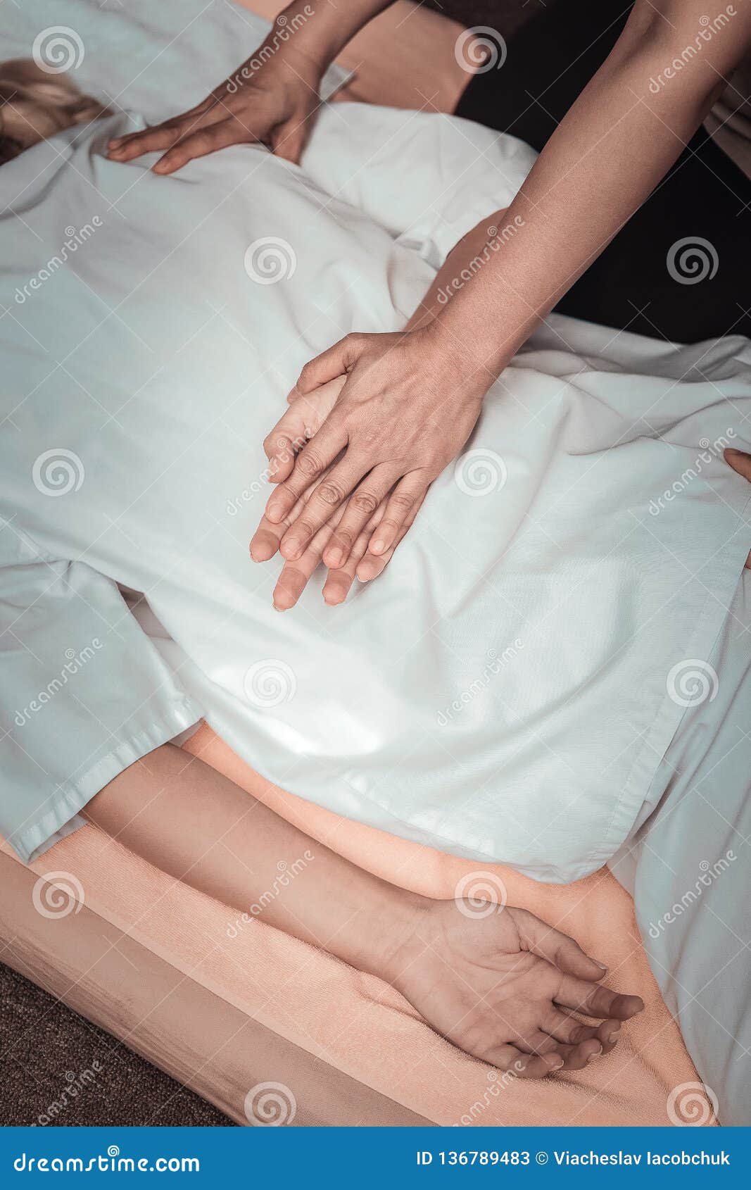 Hands Of Skilled Experienced Masseuses During The Massage