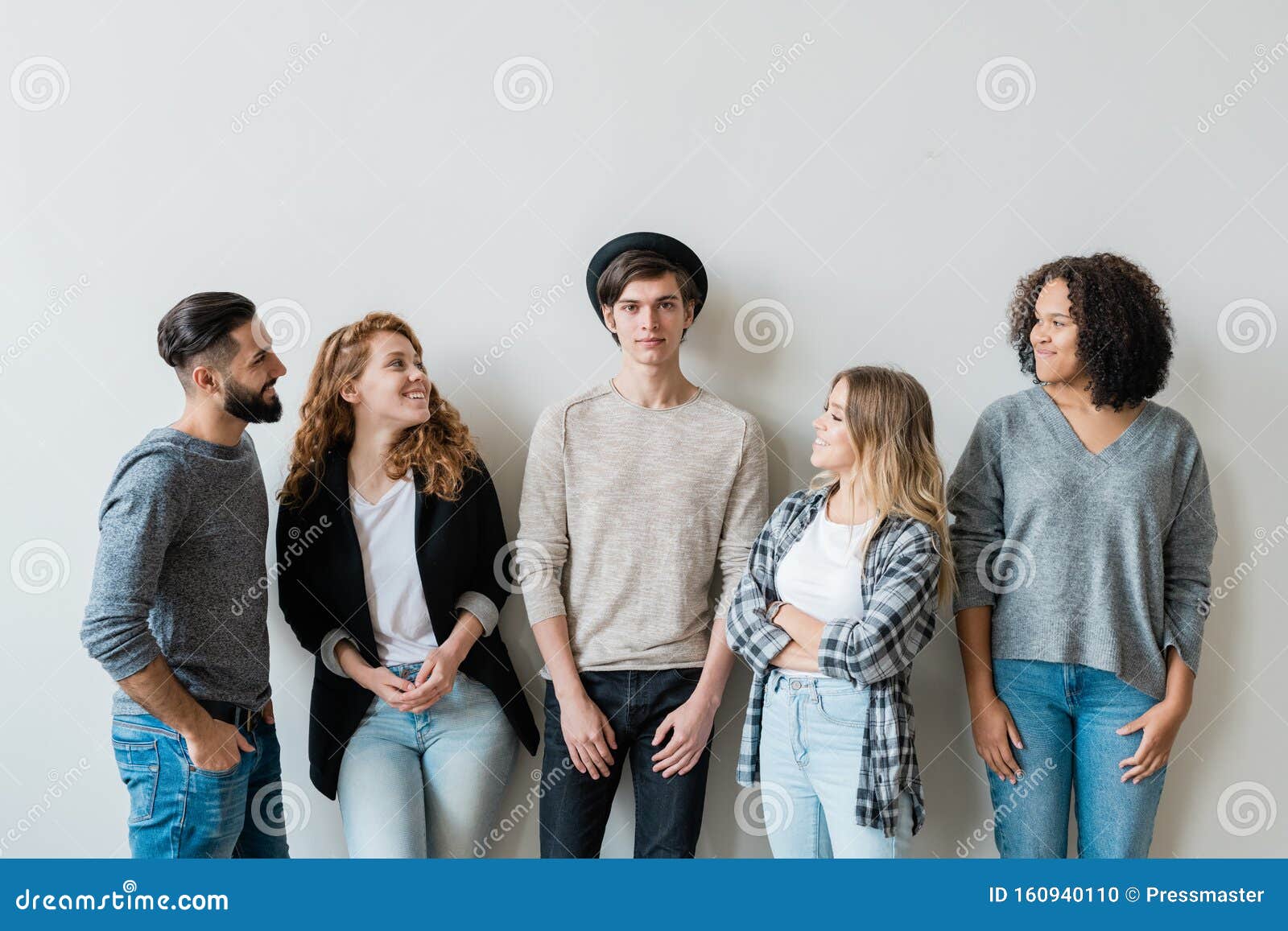 Four Happy Teenagers in Casualwear Looking at Their Handsome Friend Stock  Photo - Image of females, modern: 160940110