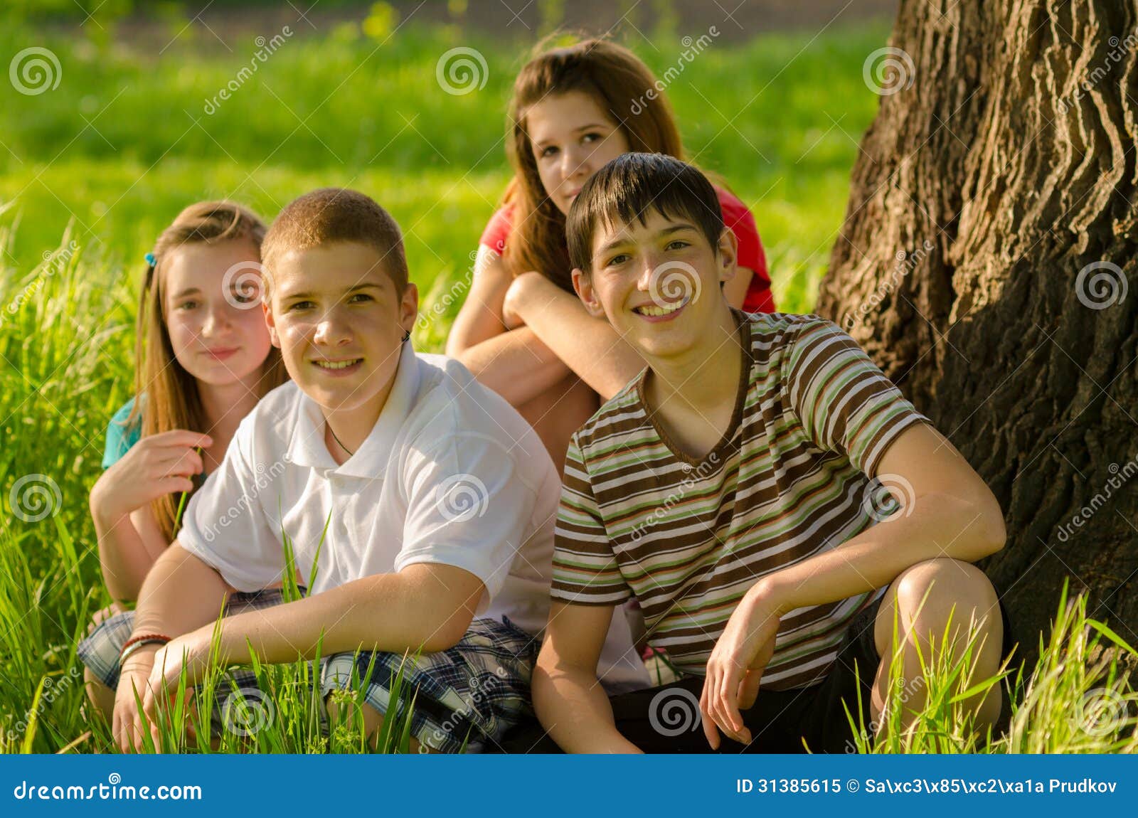 Four Happy Teenagers in the Nature Stock Image - Image of happy ...