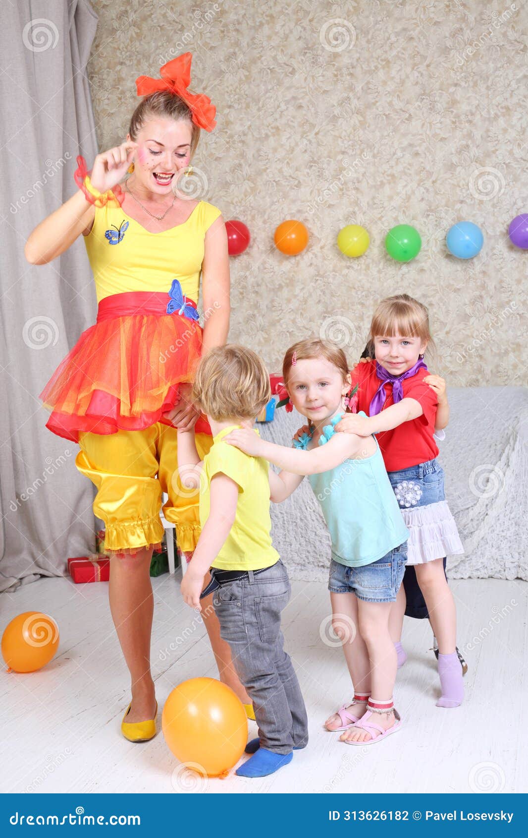 four kids and entertainer play game at funny