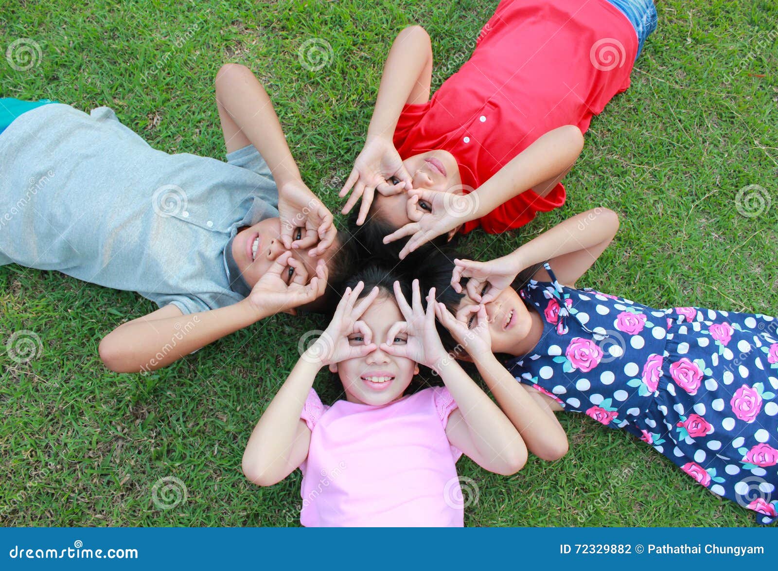 four kids having fun in the park.
