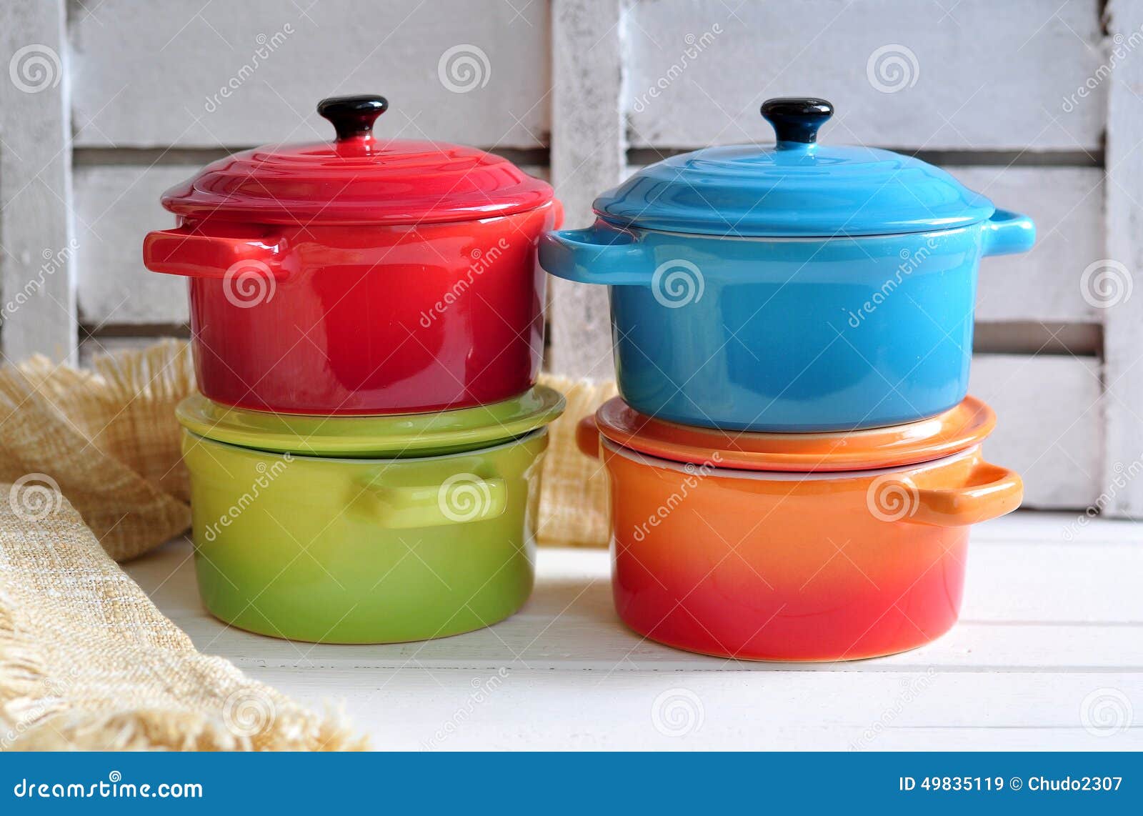 Four Little Colorful Cooking Pots And Linen Texture Stock Photo Image
