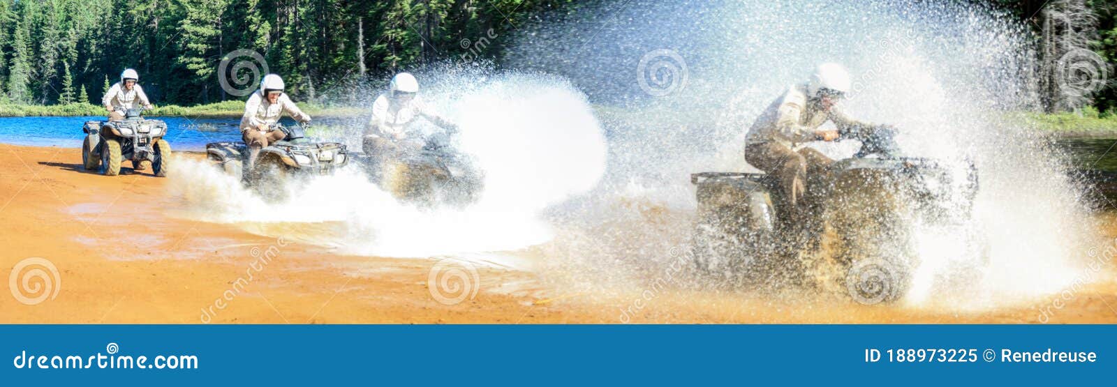 four men driving motocross atv quad through splashing river lake water with high speed. foy, foyross lake, sudbury
