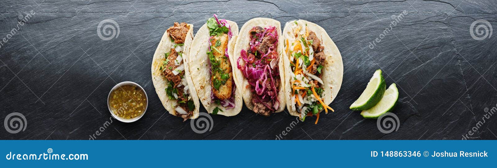 four mexican street tacos with fish barbacoa and carnitas