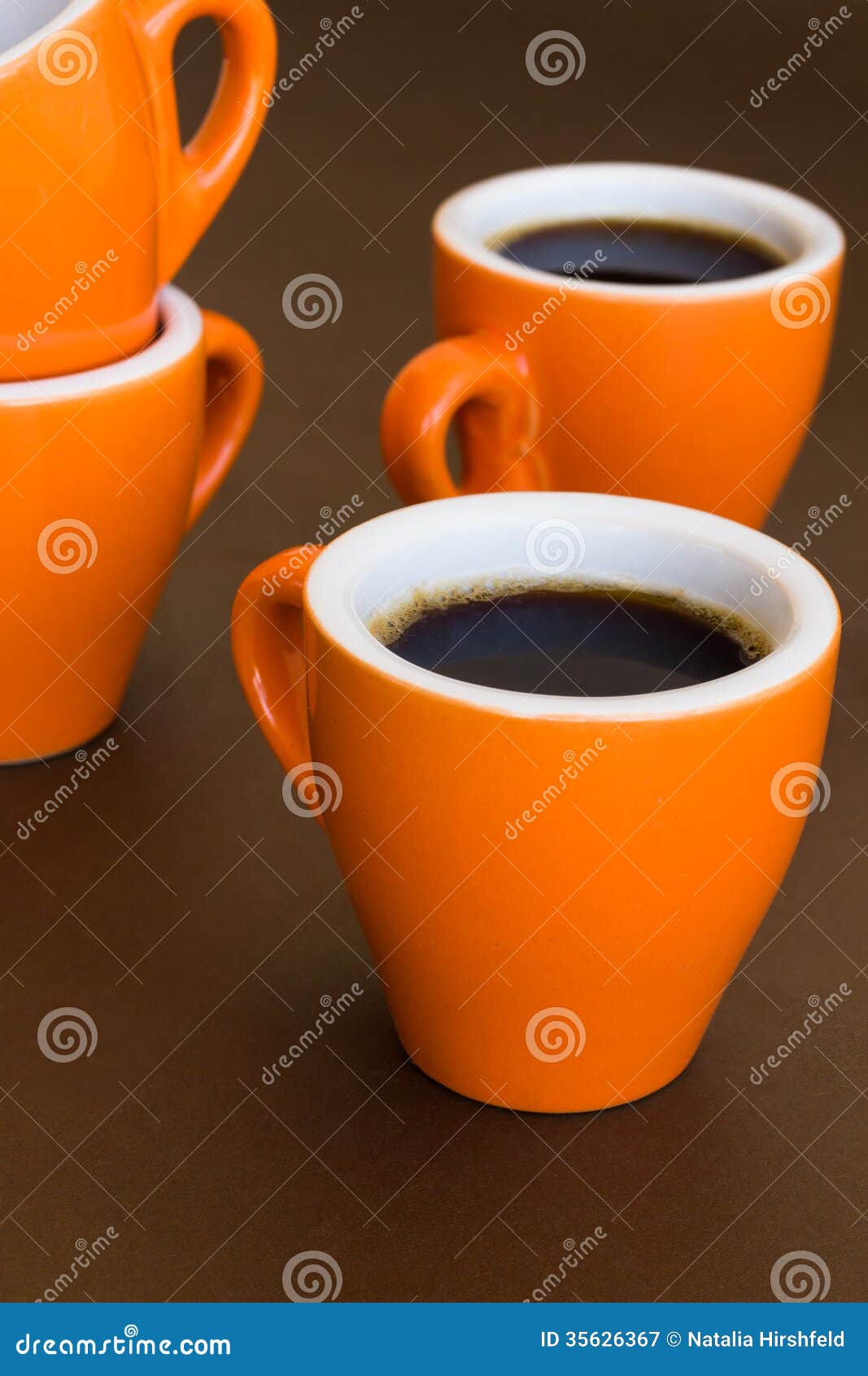 Four Modern Cups of Coffee on a Brown Surface Stock Image Image of