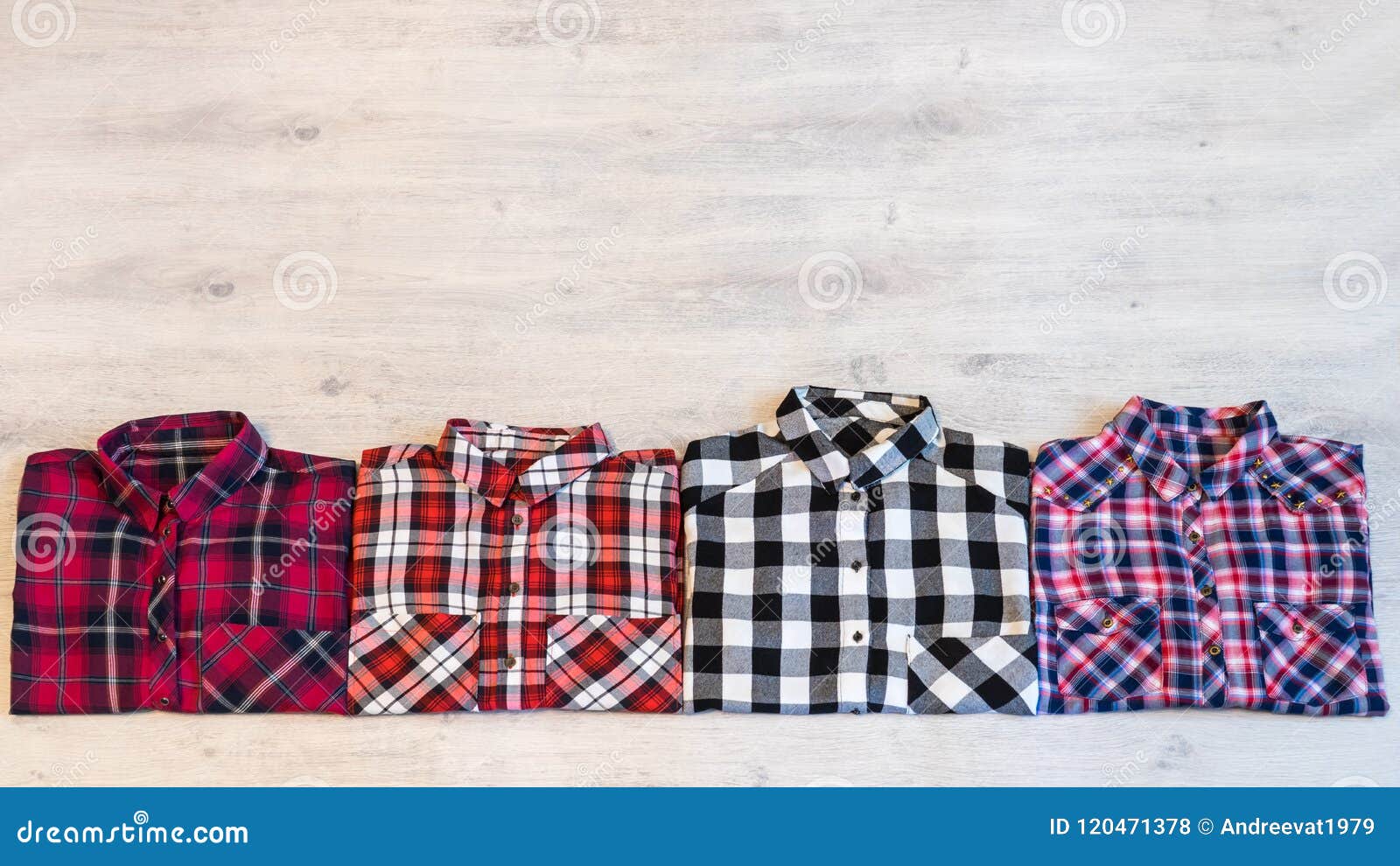 four multi-colored checkered women`s shirts lying neatly folded