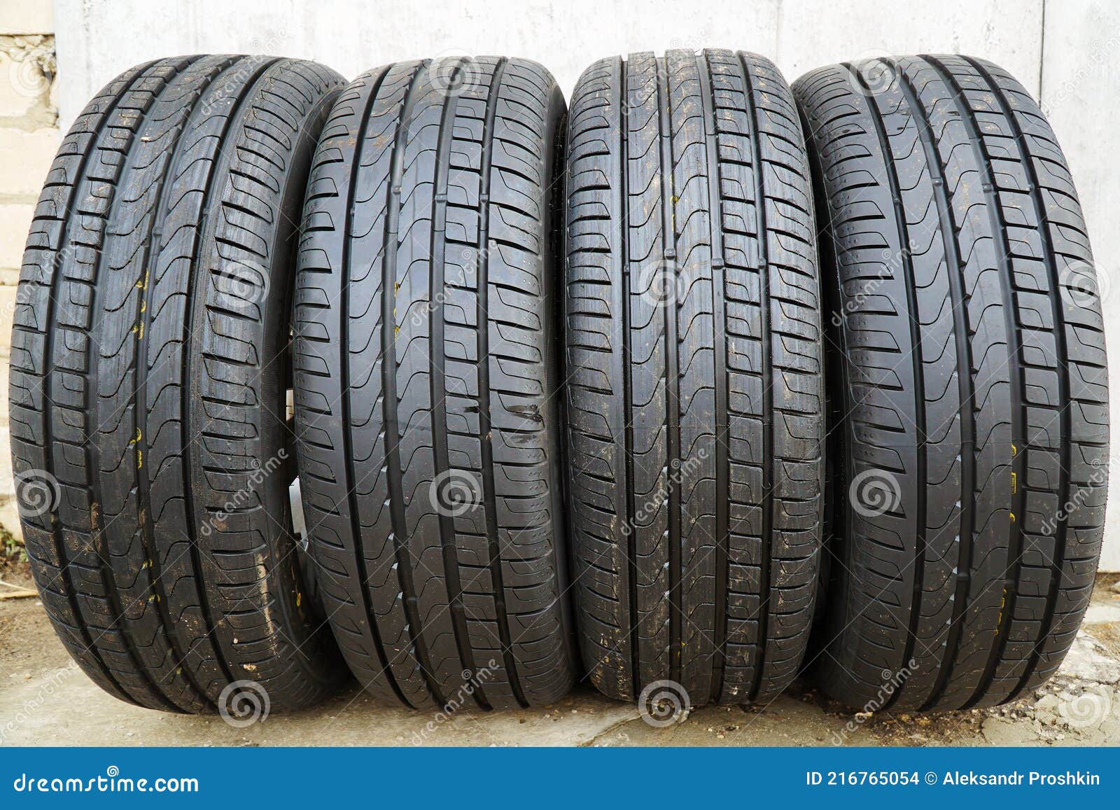 Four new black car tires stock photo. Image of safety 216765054