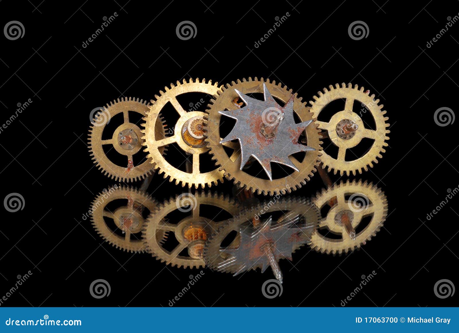 Four old rusty clock gears stock photo. Image of technology 17063700