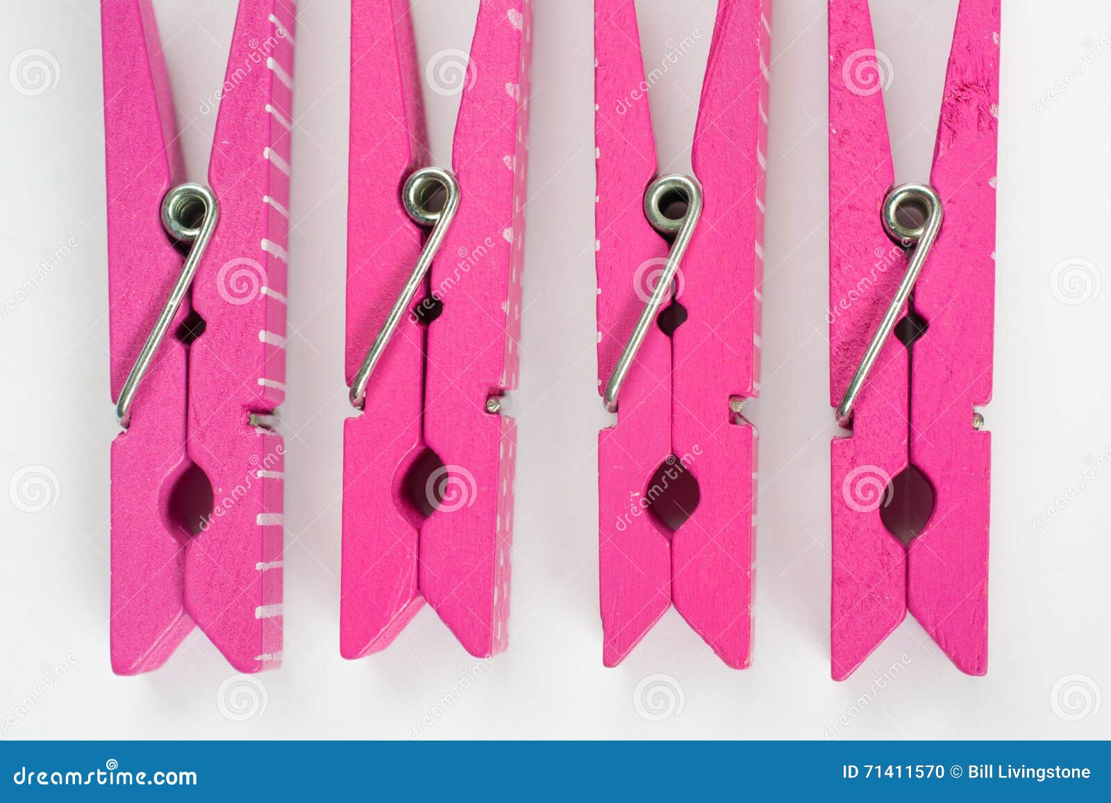 Four Pink Clothes Pins with Fun Patterns Flipped Top View Stock Photo