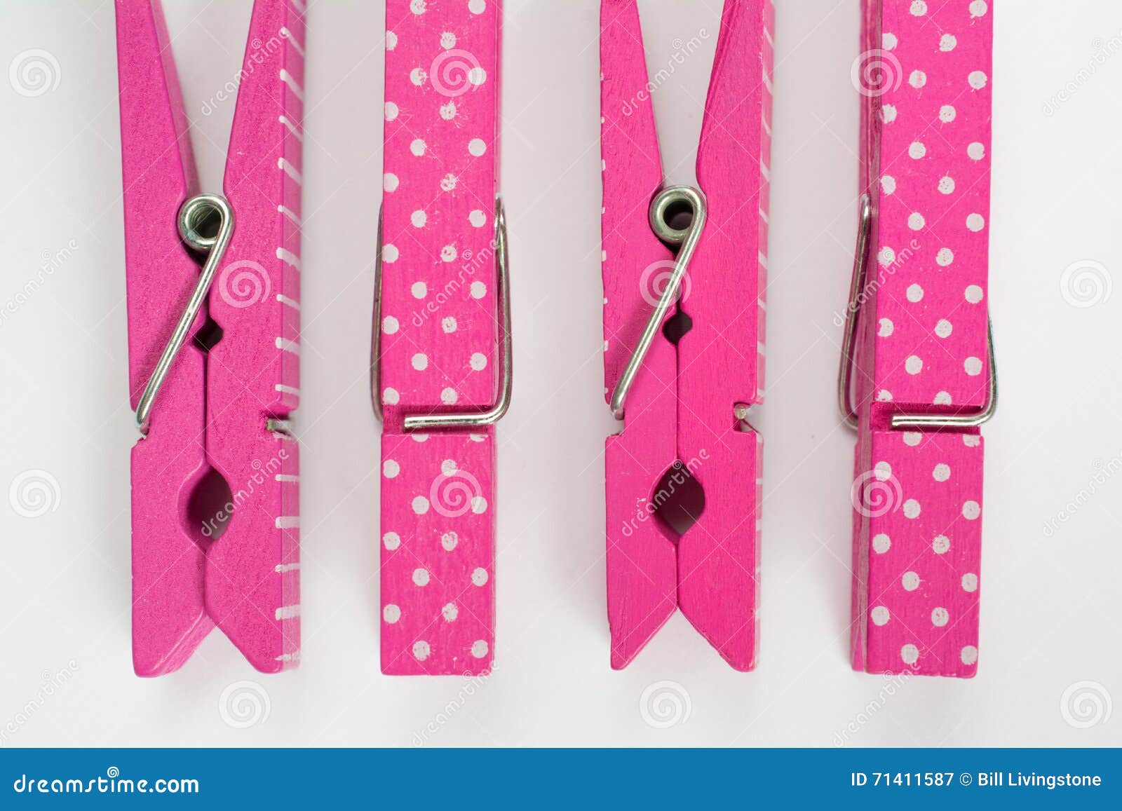 Four Pink Clothes Pins with Fun Patterns Two Flipped Top View Stock