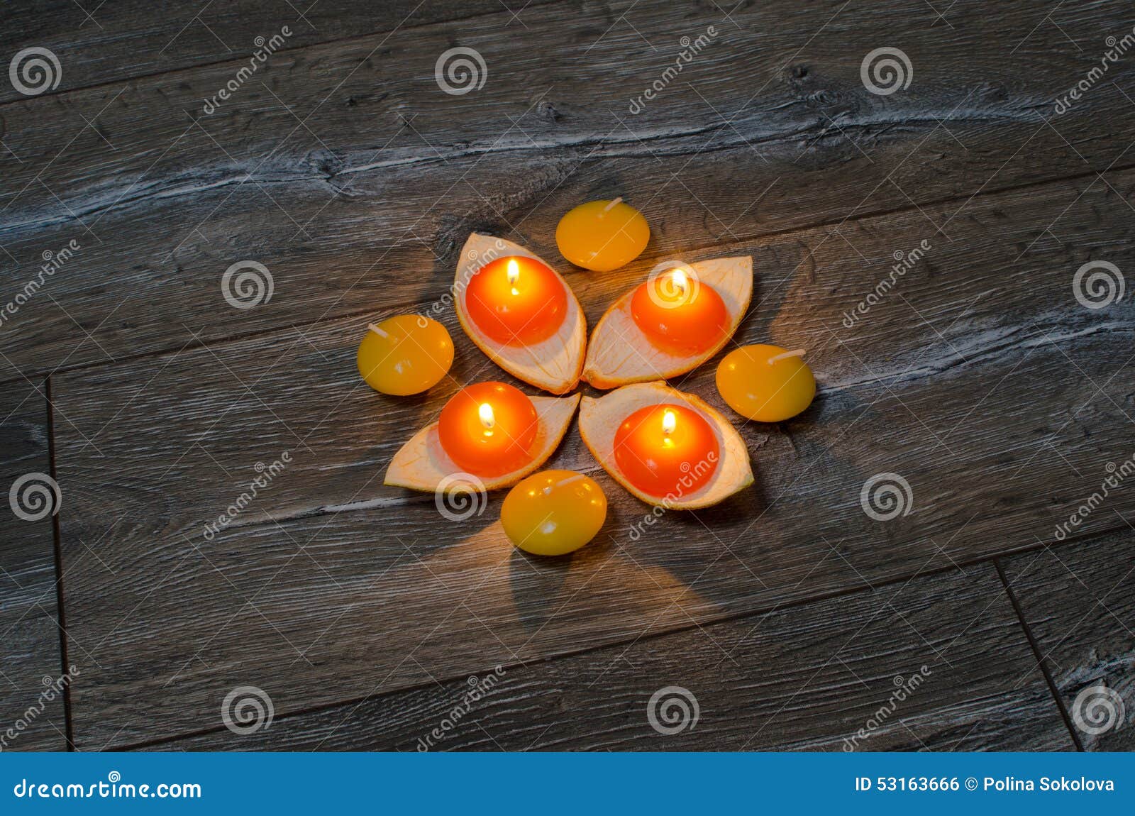 Four Round Orange Candle Burning in the Stands of the Orange Pee Stock