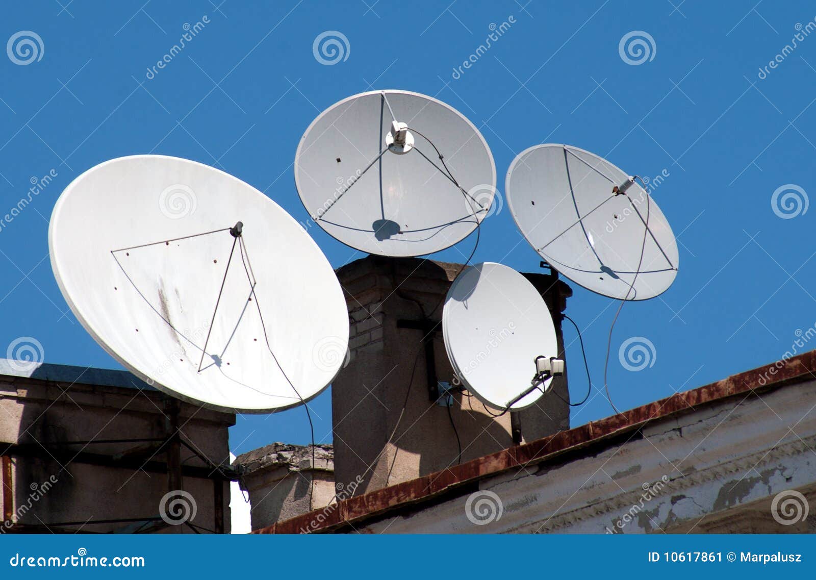four satellite dish antennas