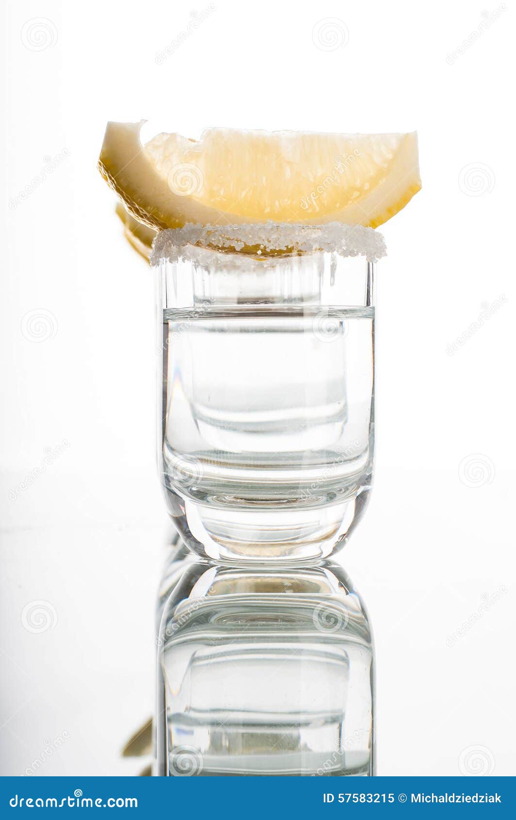 Photo of four shots of vodka with lemon