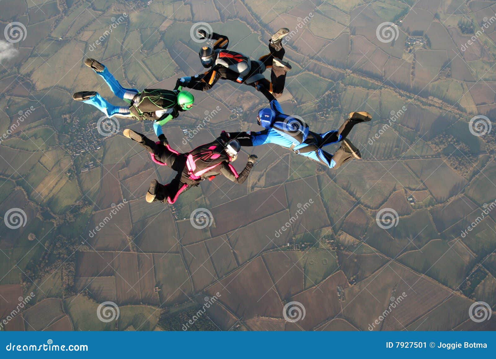 four skydivers doing formations