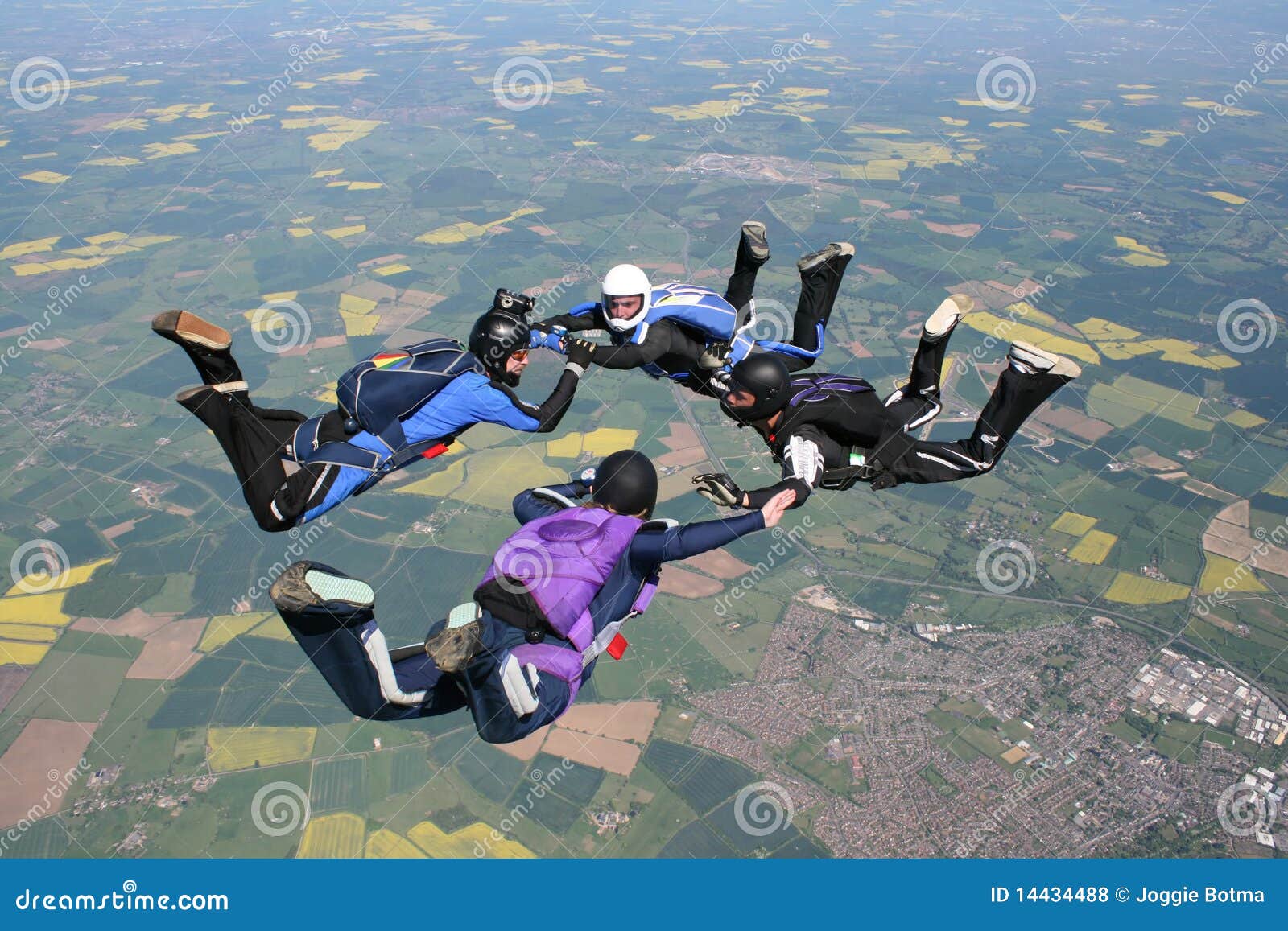 four skydivers in freefall