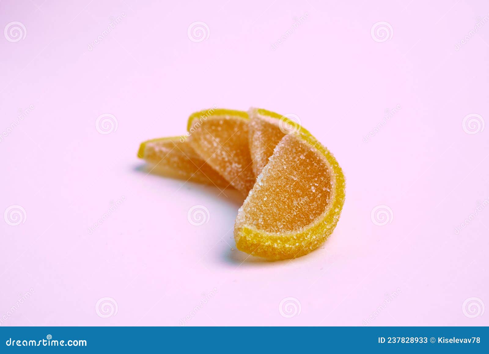 Four Slices of Marmalade in Sugar on a Pink Background. Composition of