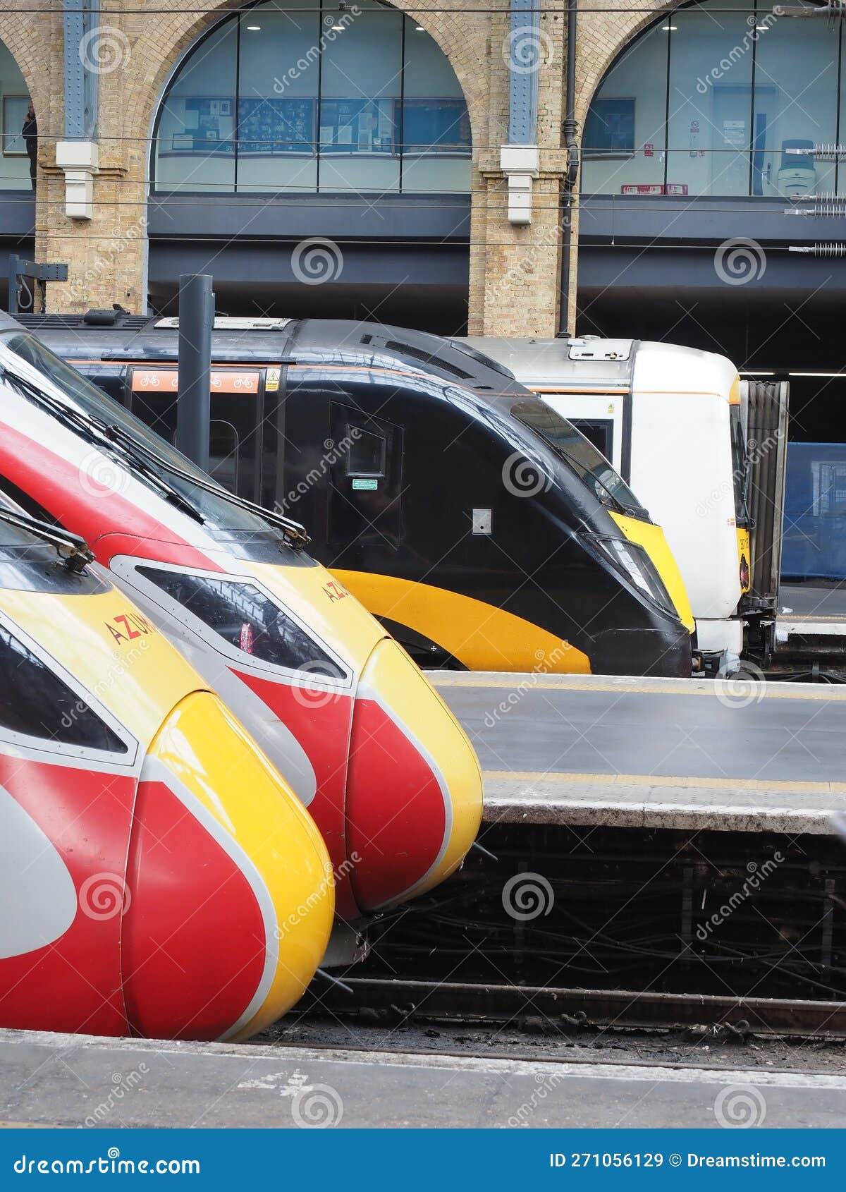 contrasting train profiles at london king's cross
