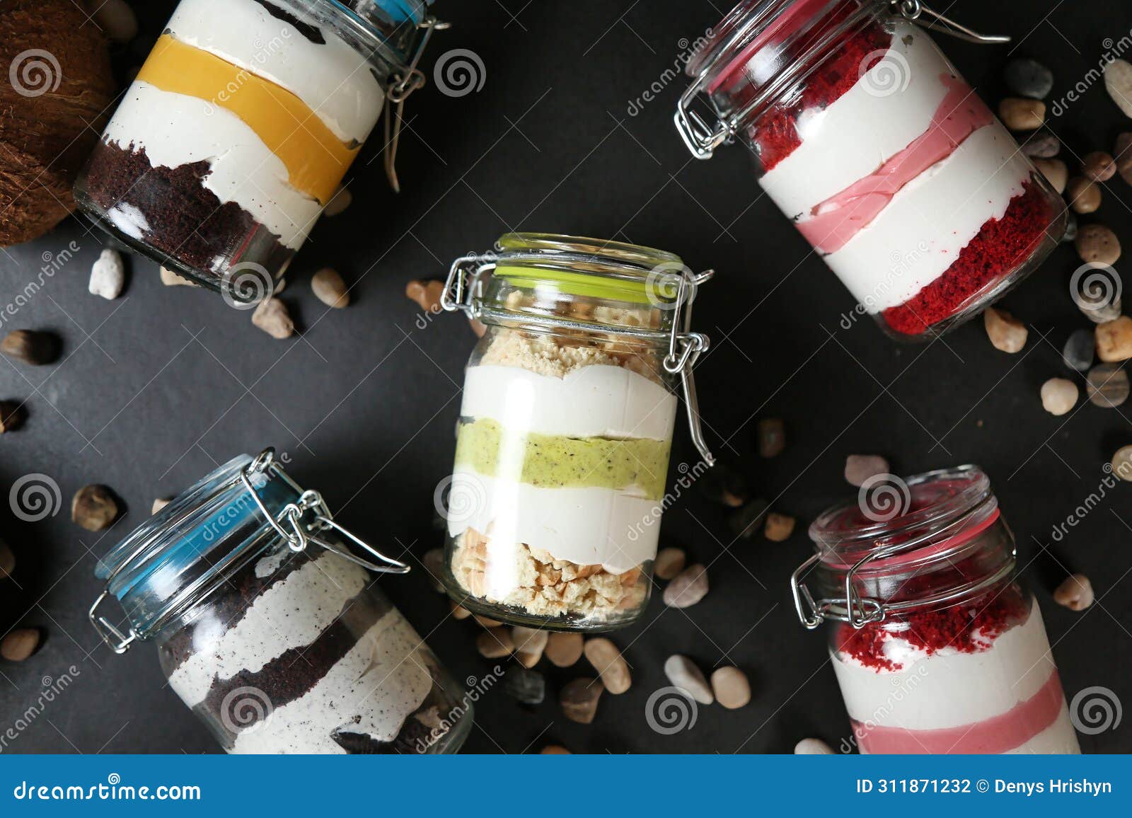 assorted desserts in four jars