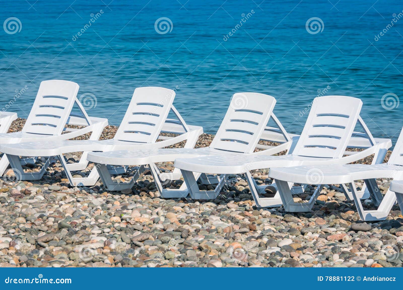 Four White Plastic Beach Chairs on the Beach Stock Photo Image of
