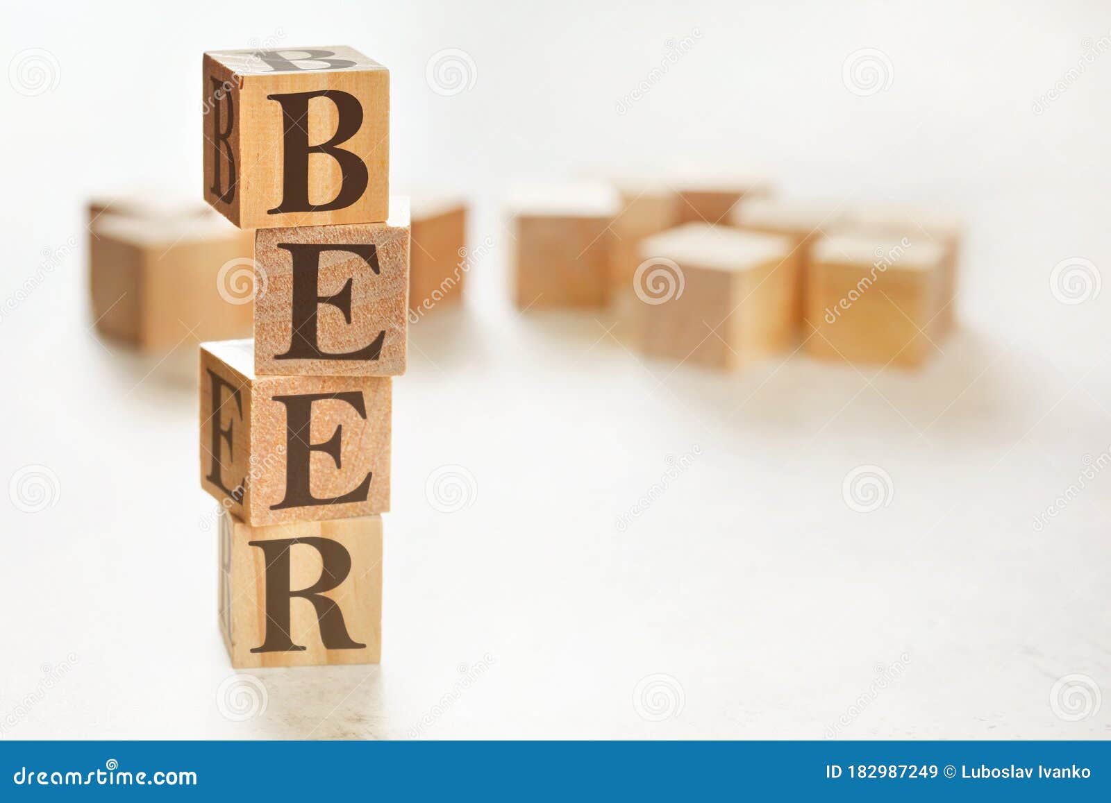 Four Wooden Cubes Arranged in Stack with Word BEER Meaning Behaviour