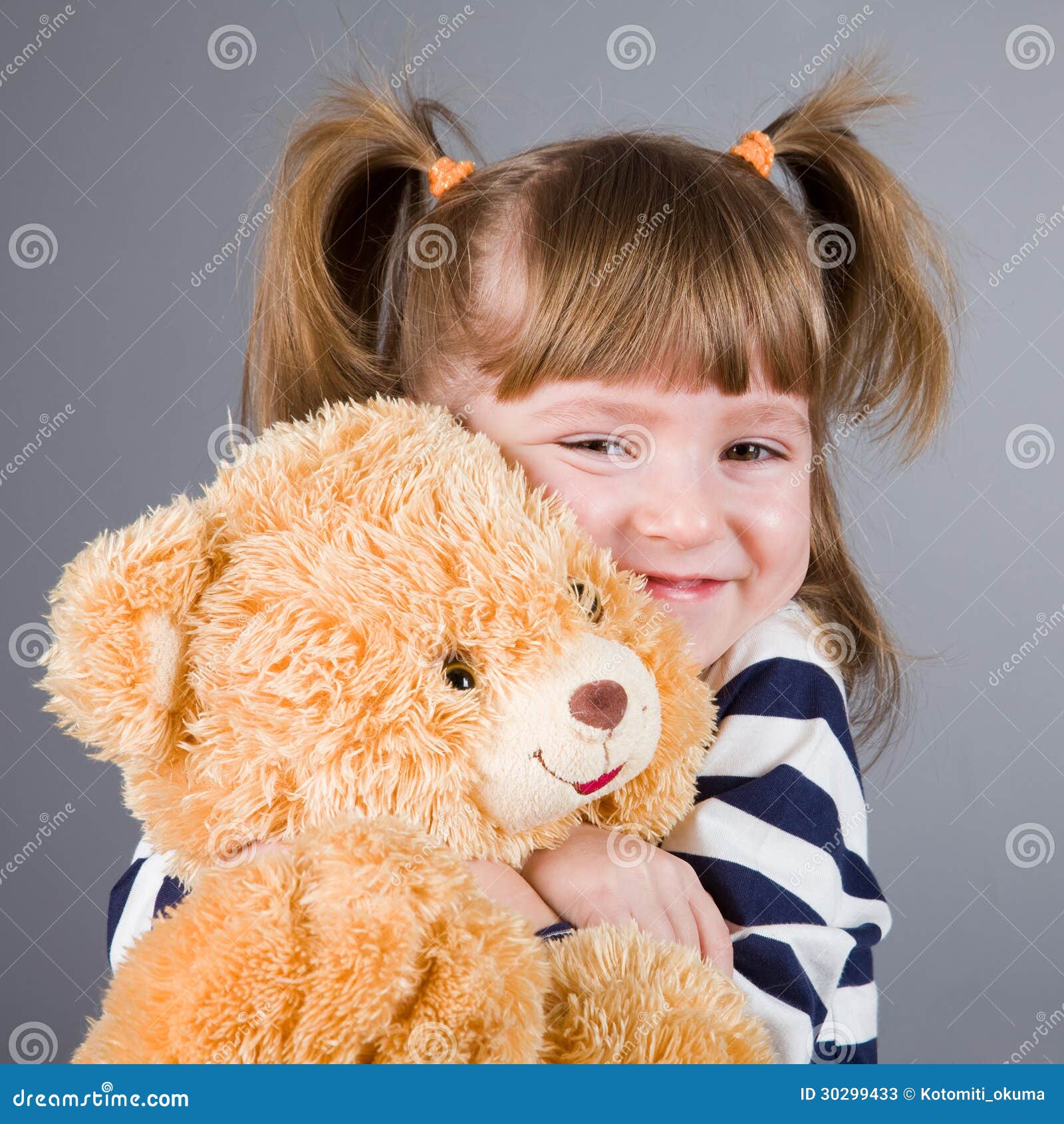 Girl sits with a toy bear stock image. Image of close - 30299433