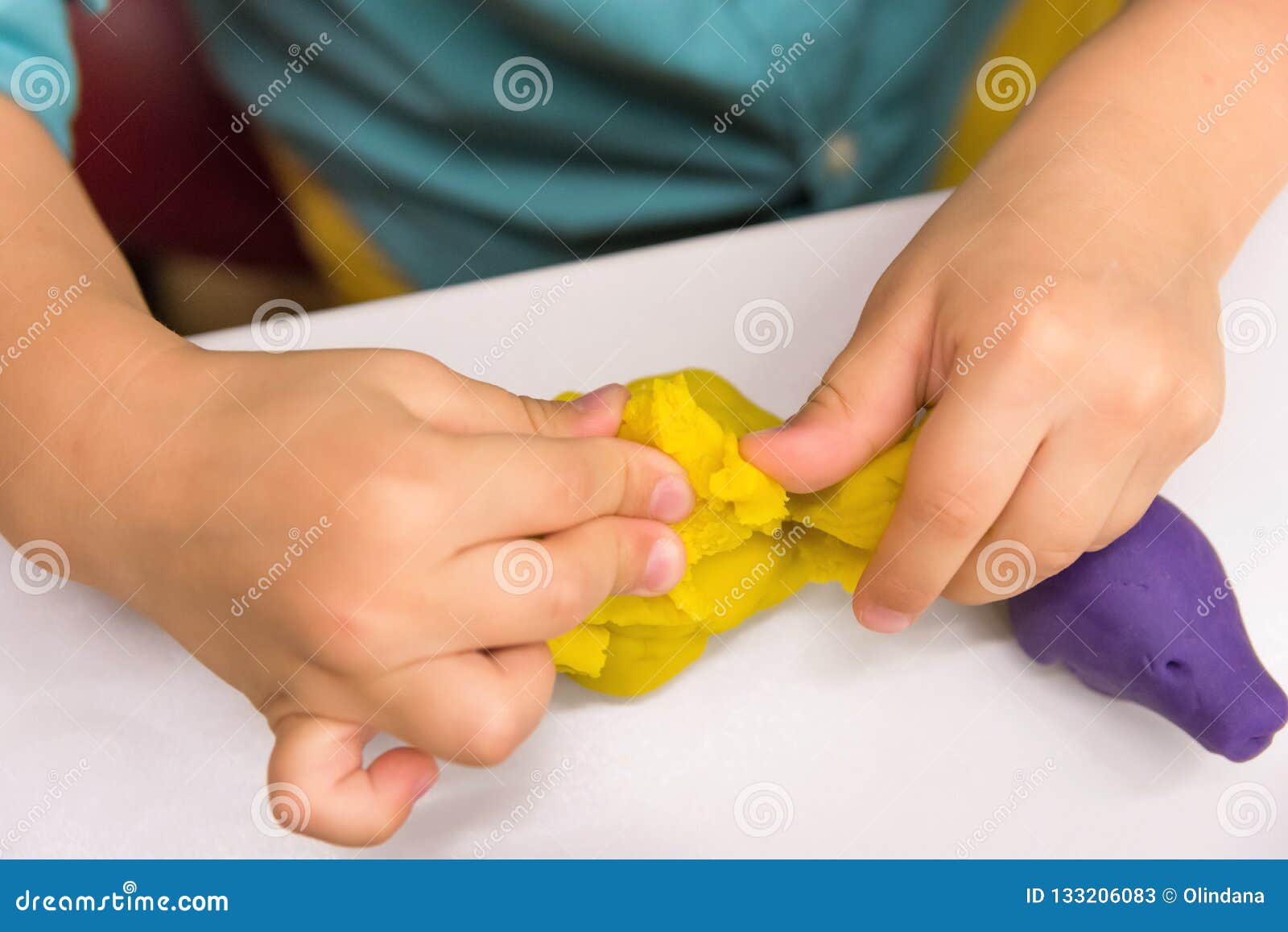 Four Year Old Caucasian Boy Makes with Hands Animal Figures from Modeling Yellow Clay on White Tabletop. Kids Creativity Preschool Stock Image - Image of modelling, clay: 133206083 Four Year Old Caucasian Boy Makes with Hands Animal Figures from Modeling Yellow Clay on White Tabletop. Kids Creativity Preschool Stock Image - Image of modelling, clay: 133206083