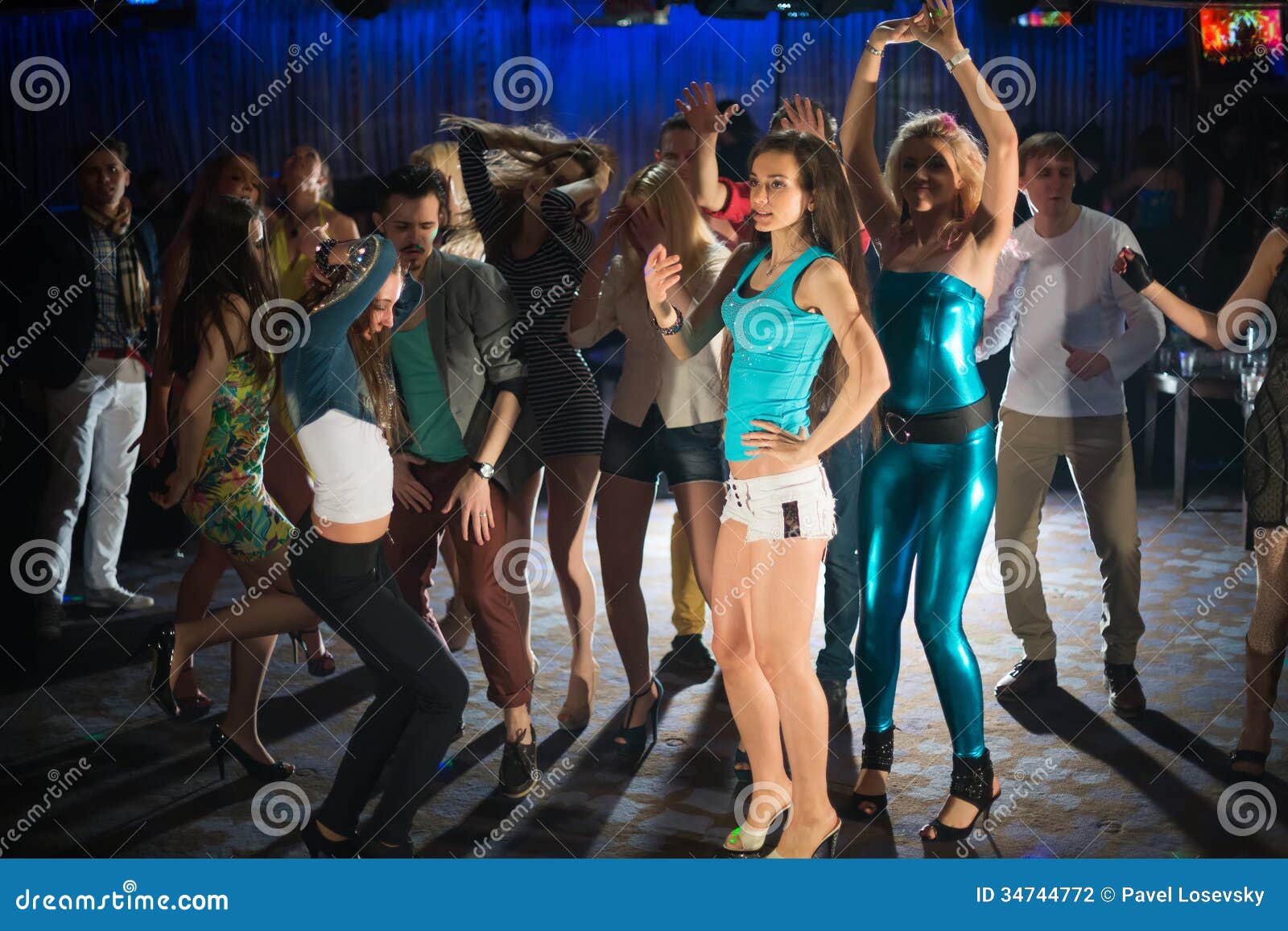 fourteen young people having fun and dancing
