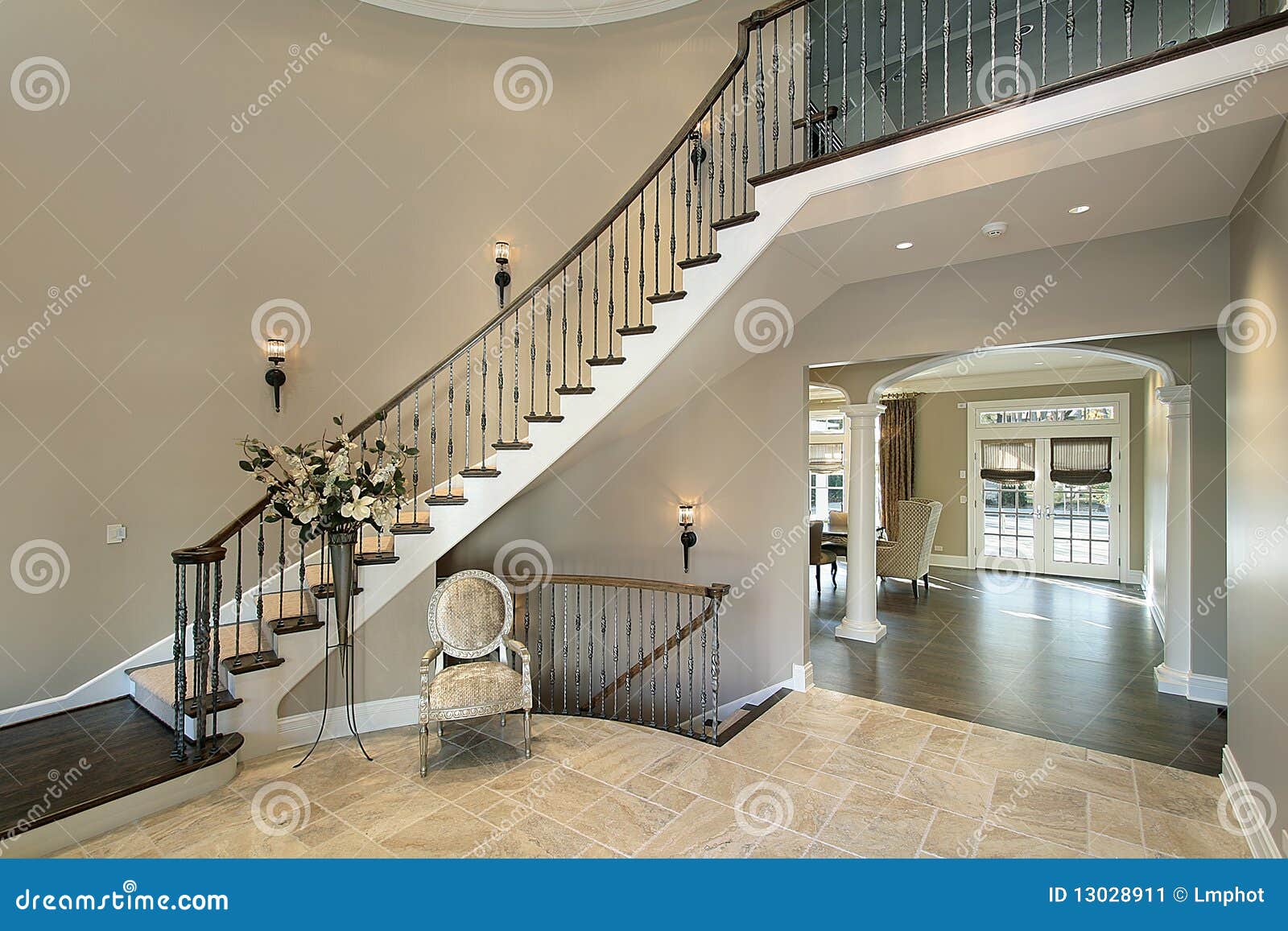 Foyer with Curved Staircase Stock Image Image of family, luxury 13028911