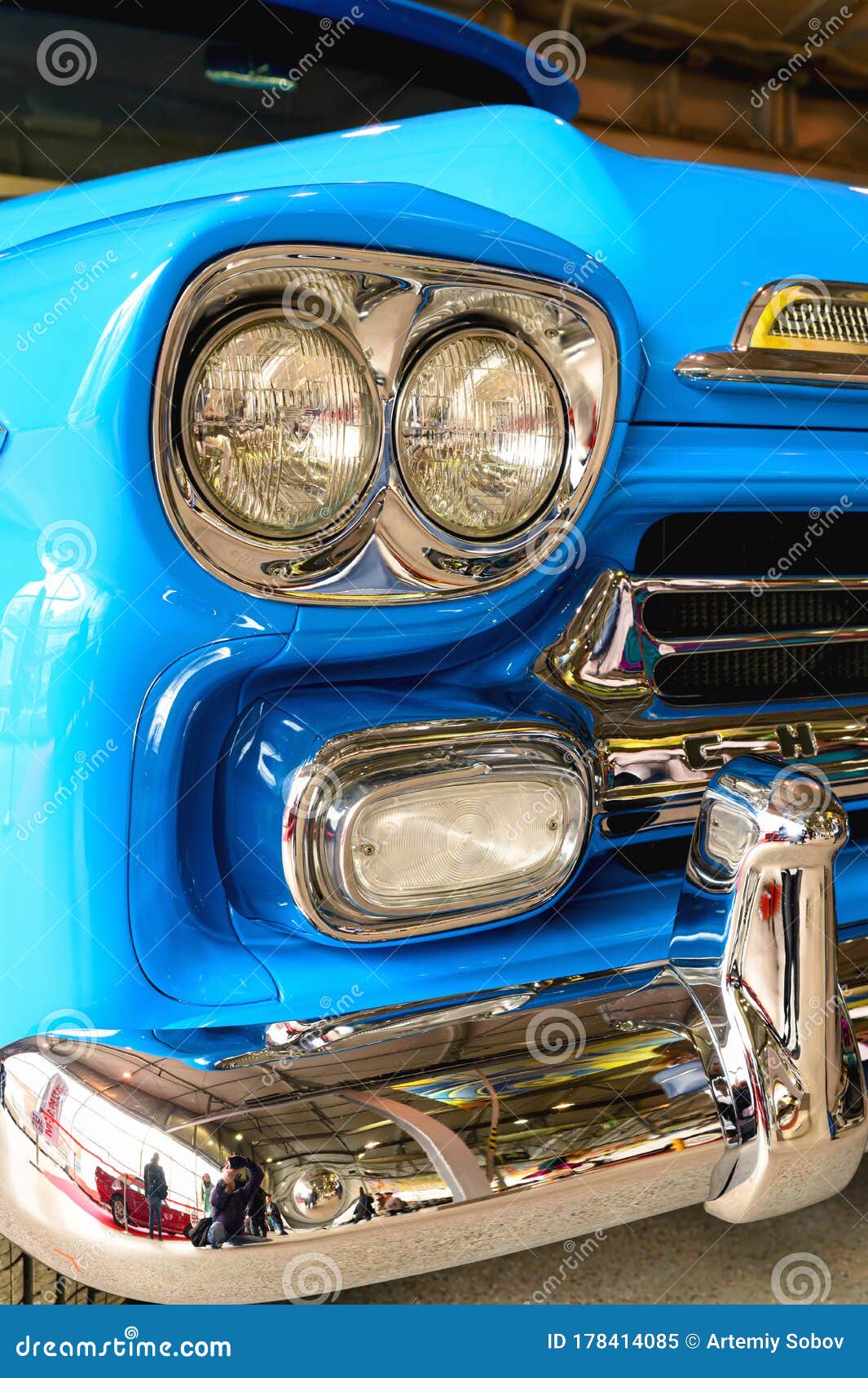 A Fragment of the Front of the Car Closeup. Headlight and Bumper of