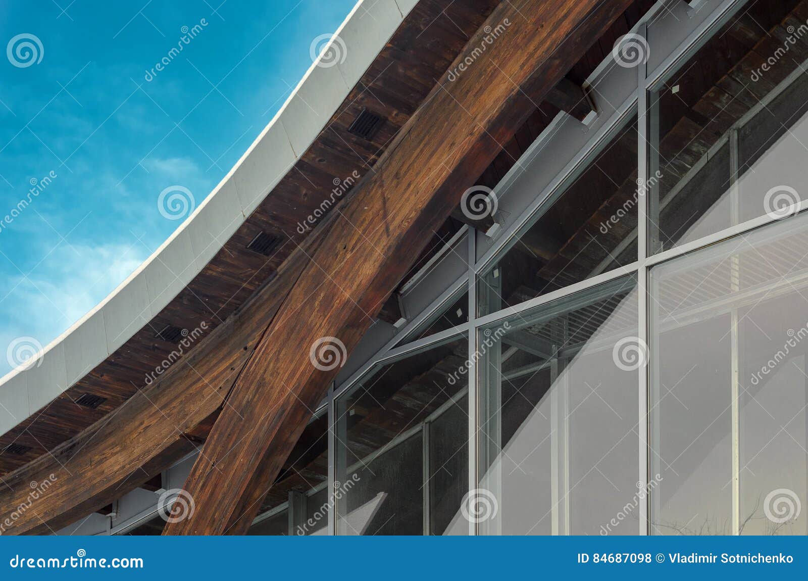 fragment of modern building with structural glass wall