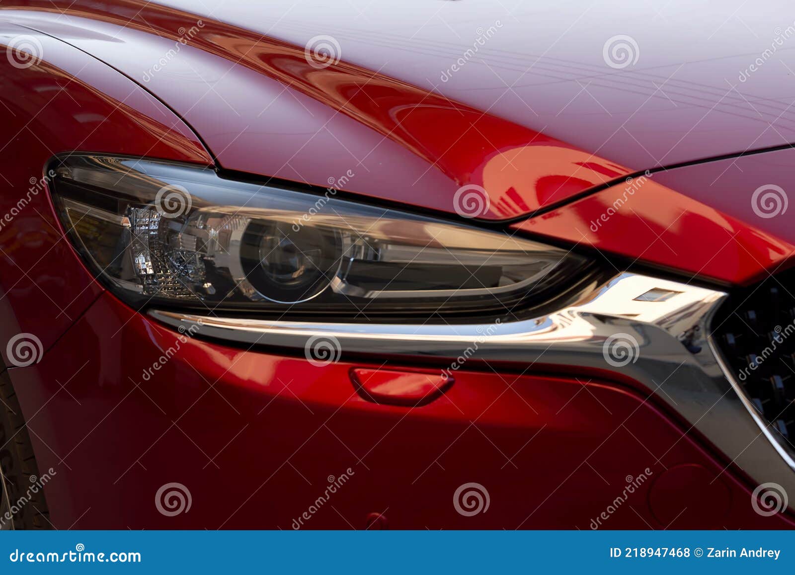 Fragment of a Modern Red Car, Headlight and Bumper Stock Photo Image