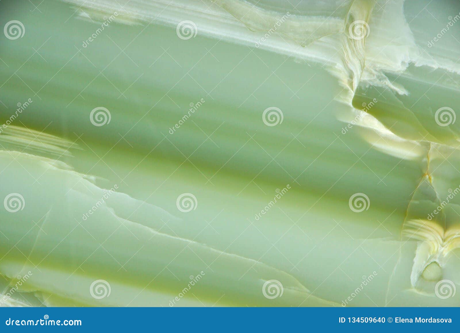 fragment of natural polished verde onyx stone of green color with stripes and streaks