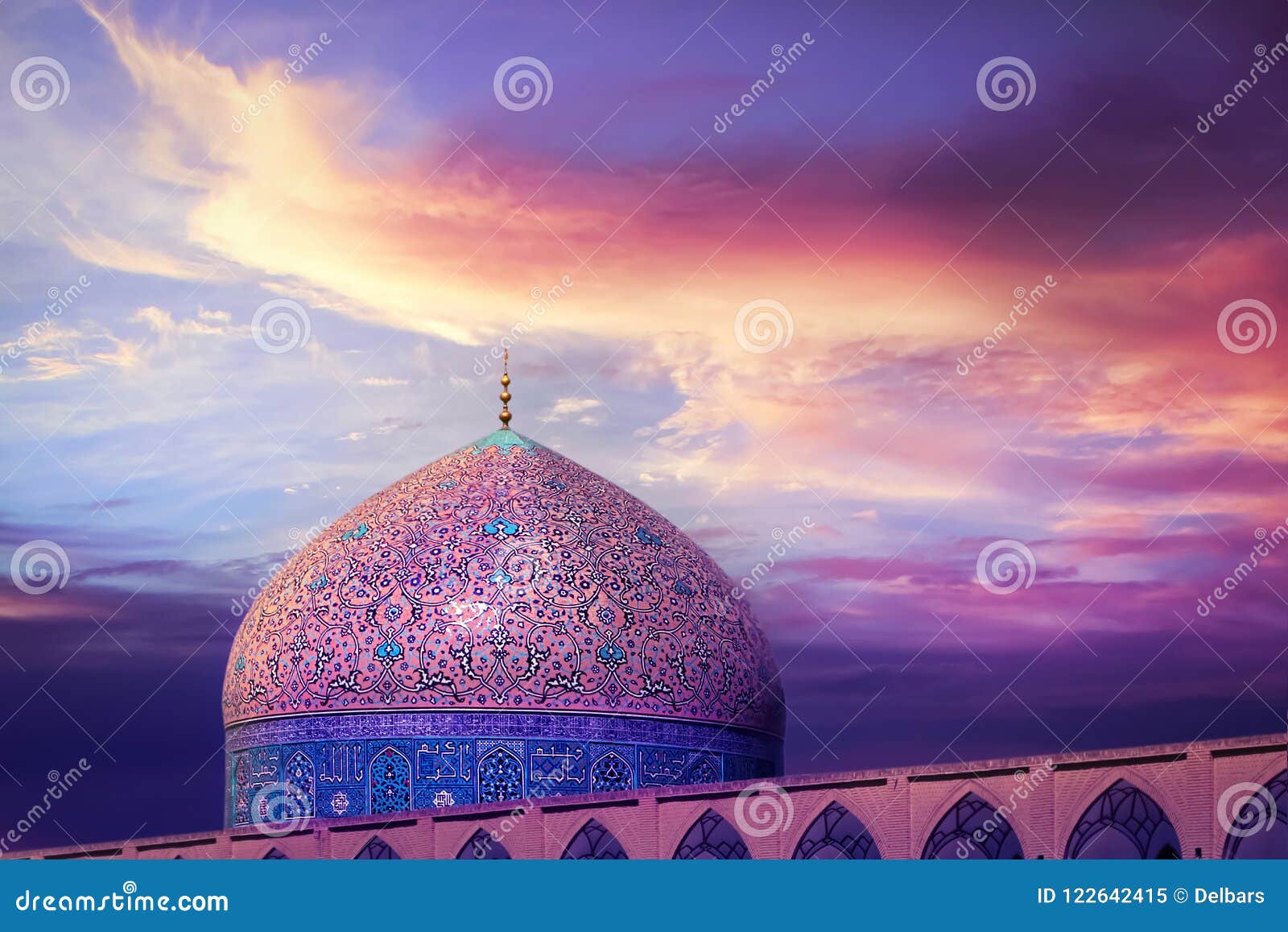 fragment of traditional iranian architecture against beatiful purple sky and yellow and pink clouds. beautiful sunset.