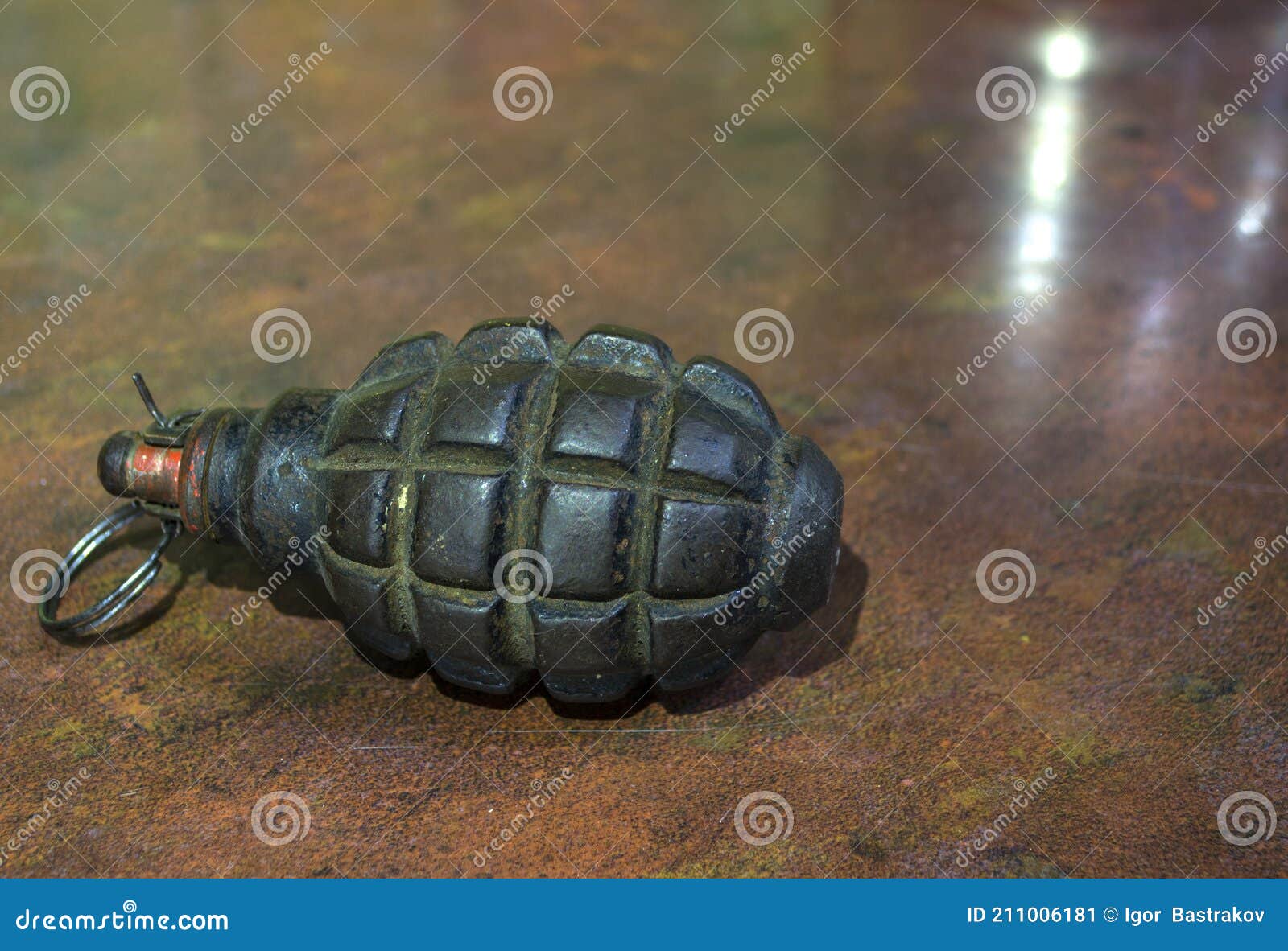 fragmentation grenade with hole, on camouflage clothing