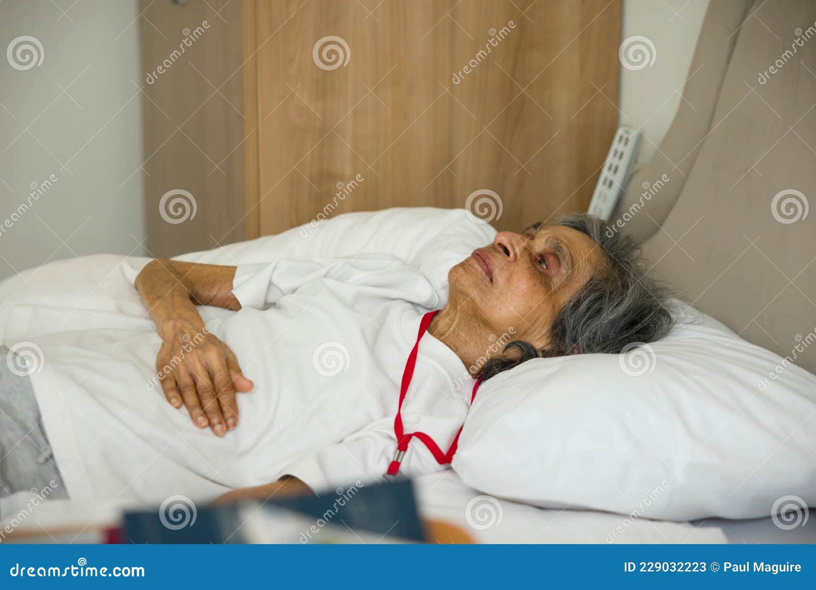 Frail Old Woman Lying In A Bed In Hospital Or Nursing Home Uk Stock